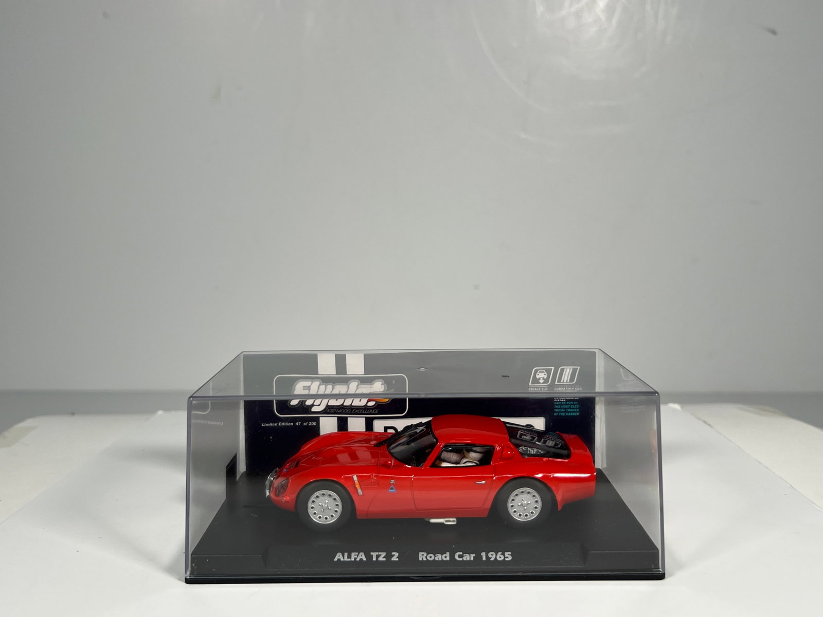 Fly Slot Cars Alfa TZ2 Road Car 1965: Fly Slot Cars Alfa TZ2 Road Car 1965 1/32 Slot Car. Reference #057303, with original case. Weight: 5 oz.