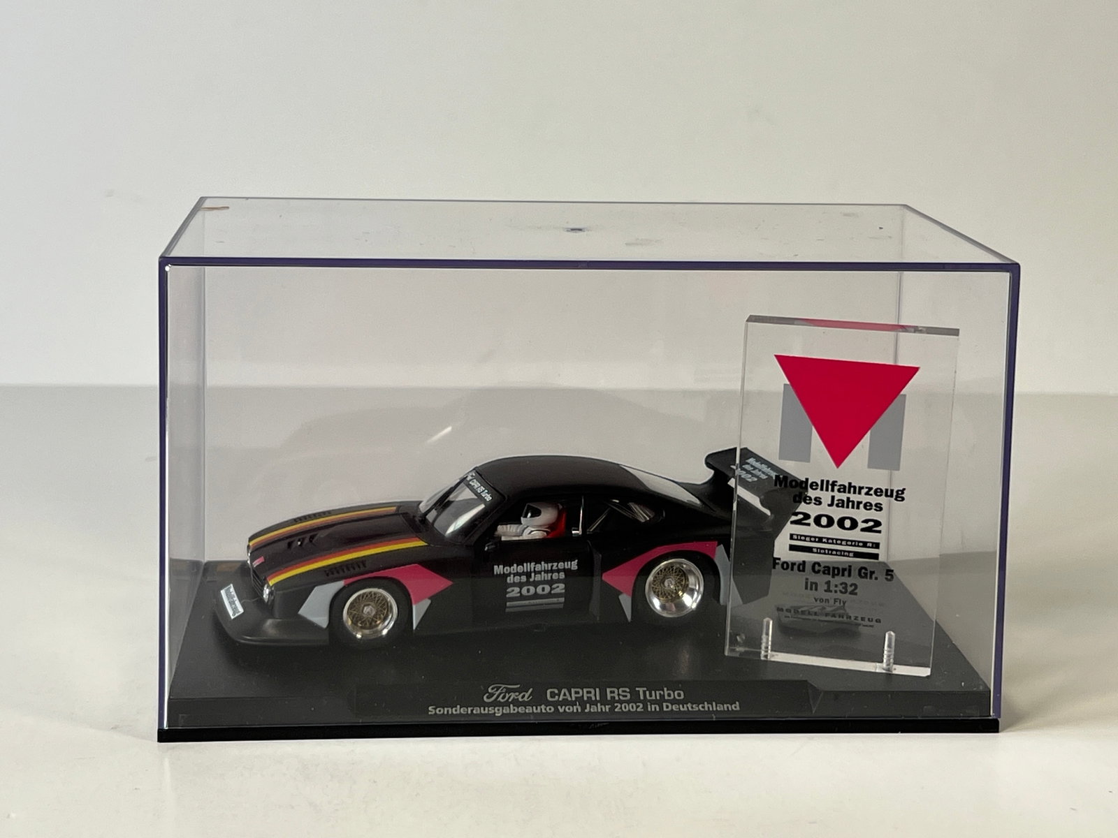 Fly Slot Car Ford Capri RS Turbo 2002: Fly Slot Car Ford Capri Group 5 RS Turbo 2002 1/32 slot car. Displayed in a clear plastic case with a commemorative plaque. Modellfahrzeug des Jahres 2002.