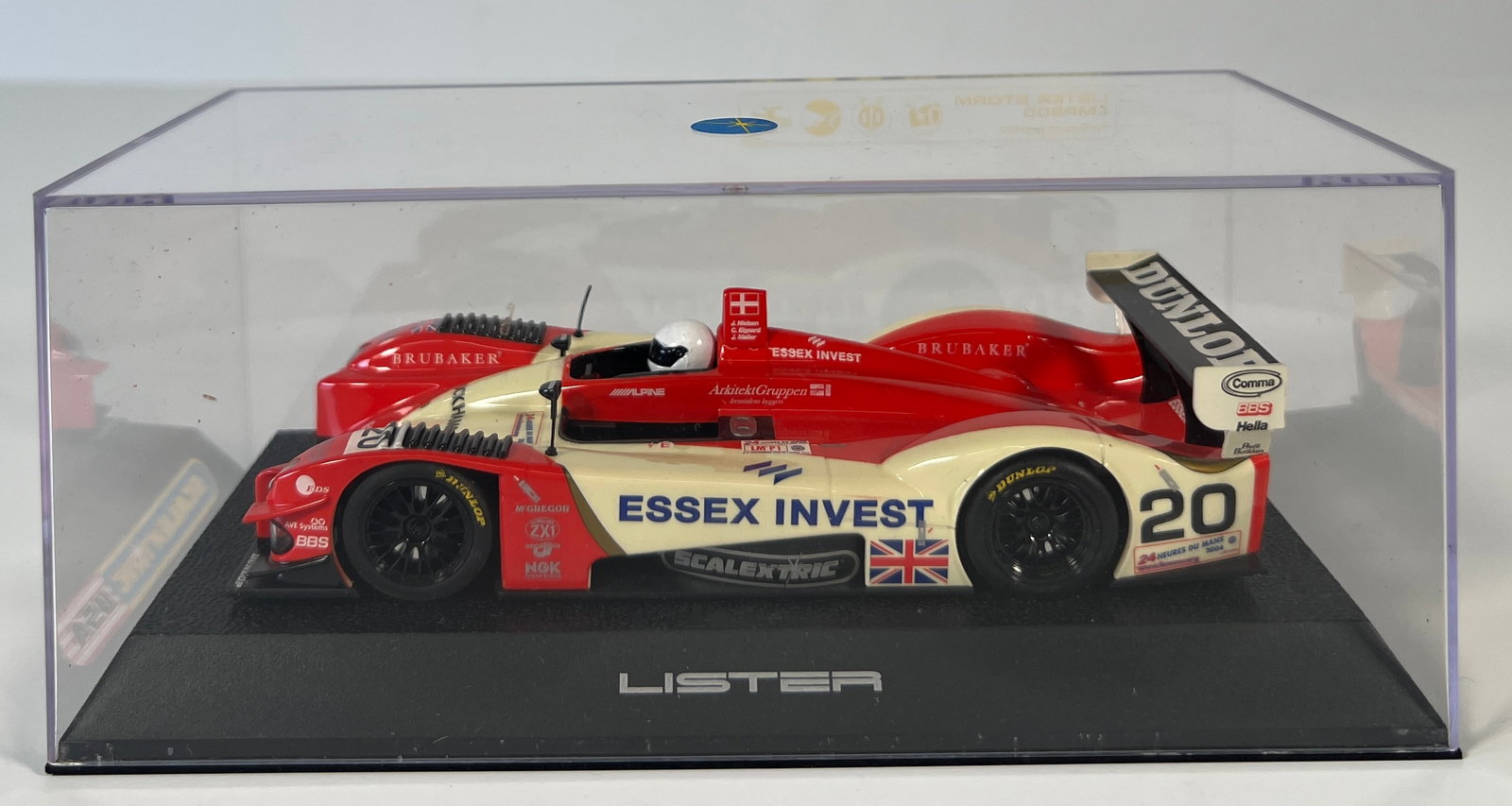 Scalextric USA Lister Storm #20: Scalextric USA Lister Storm #20 Essex Invest 1/32 Slot Car. Reference #LMP900, with original case. Case measures 3 x 7 inches. Weight: 7 oz.