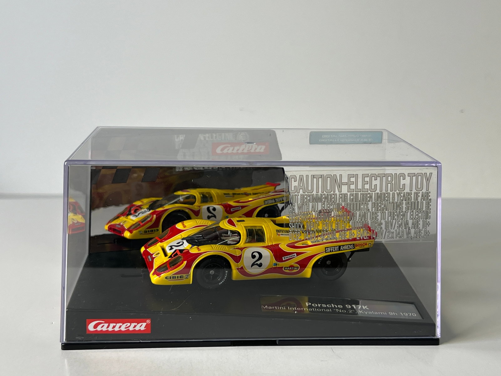 Carrera Evolution Porsche 917K Kyalami 9h 1970 #2: Carrera Evolution Porsche 917K Martini International Kyalami 9h 1970 #2 Shell 1/32 Slot Car, with original case. Weight: 15 oz. Digitally upgradeable.