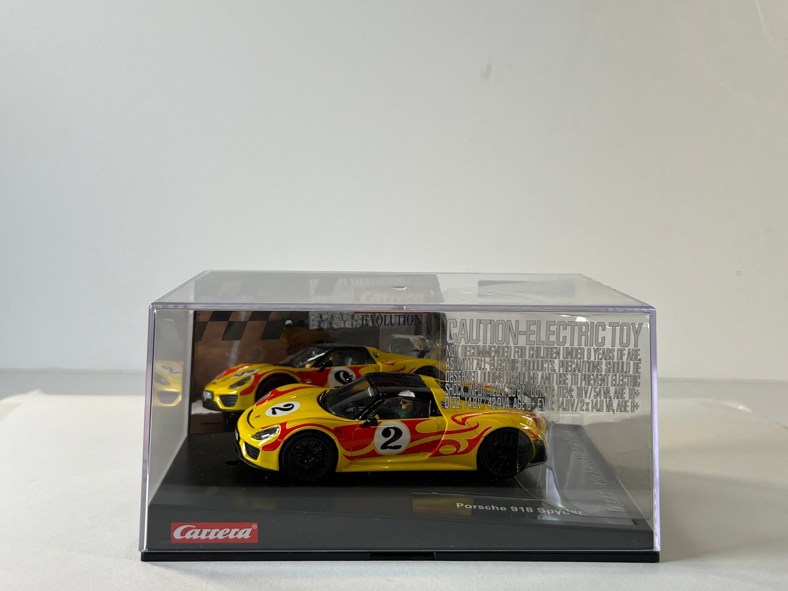 Carrera Evolution Porsche 918 Spyder #2: Carrera Evolution Porsche 918 Spyder #2 1/32 Slot Car, with original case. Case measures 4 x 8 inches. Weight: 15 oz. Digitally upgradeable.
