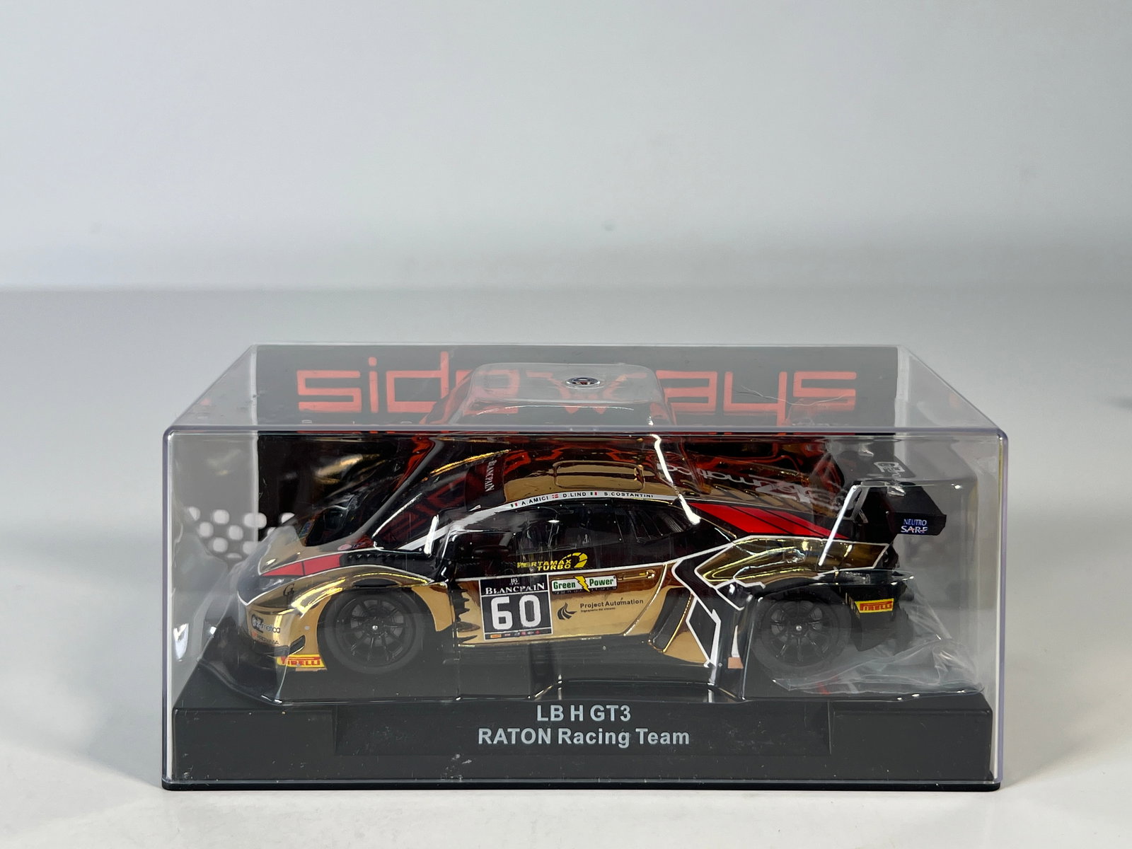 Sideways LB H GT3 Raton Racing #60: Sideways LB H GT3 Raton Racing Gold #60 BlancPain 1/32 Slot Car. Reference #SWCAR01F, with original case. Weight: 7.2 oz.