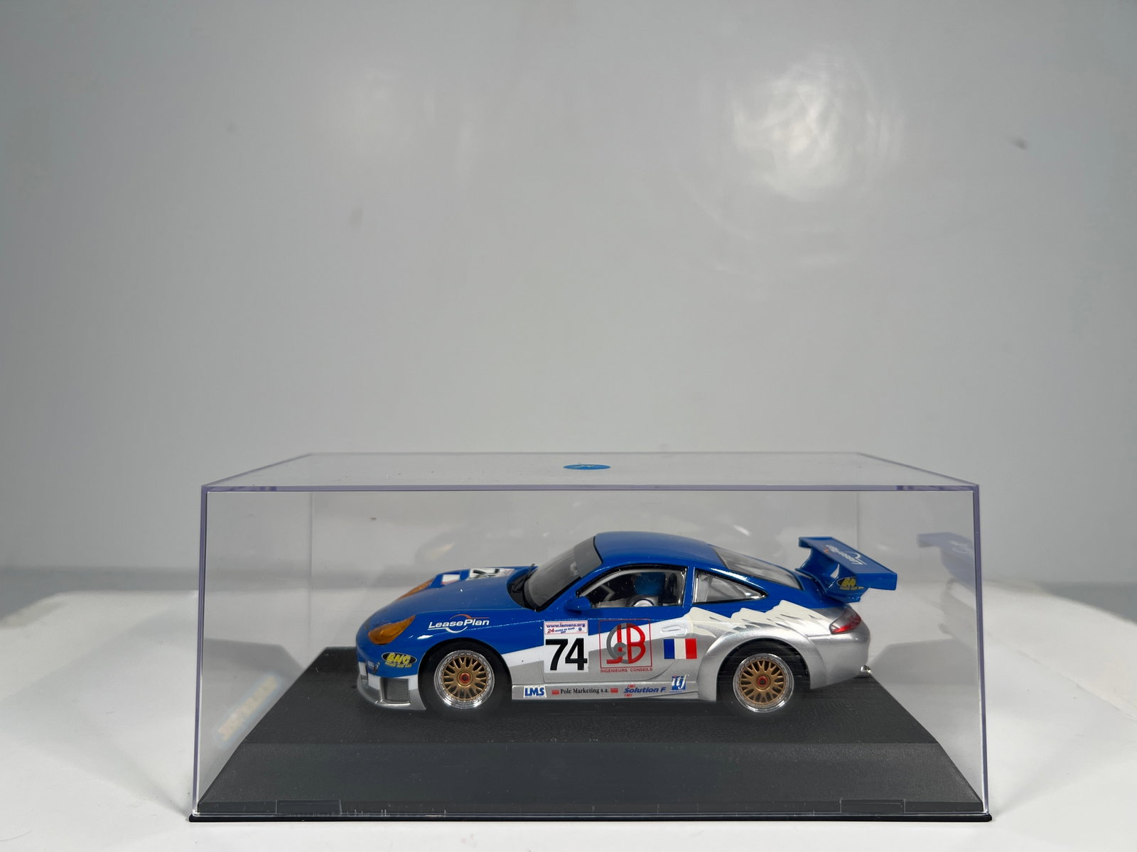 Scalextric Porsche 911 GT3R #74: Scalextric Porsche 911 GT3R #74 LeasePlan 1/32 Slot Car, with original case. Weight: 9 oz.