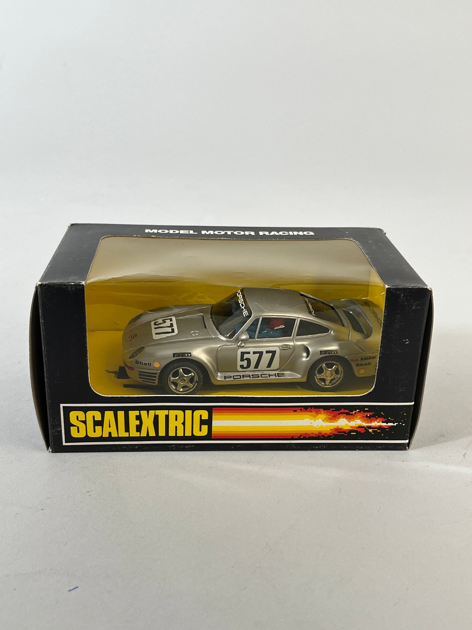 Scalextric Porsche 959 #577: Scalextric Porsche 959 #577 1/32 slot car, presented in its original packaging. Weight 6 oz. Dimensions: 3.75'' x 6.75'' x 3.75''. 