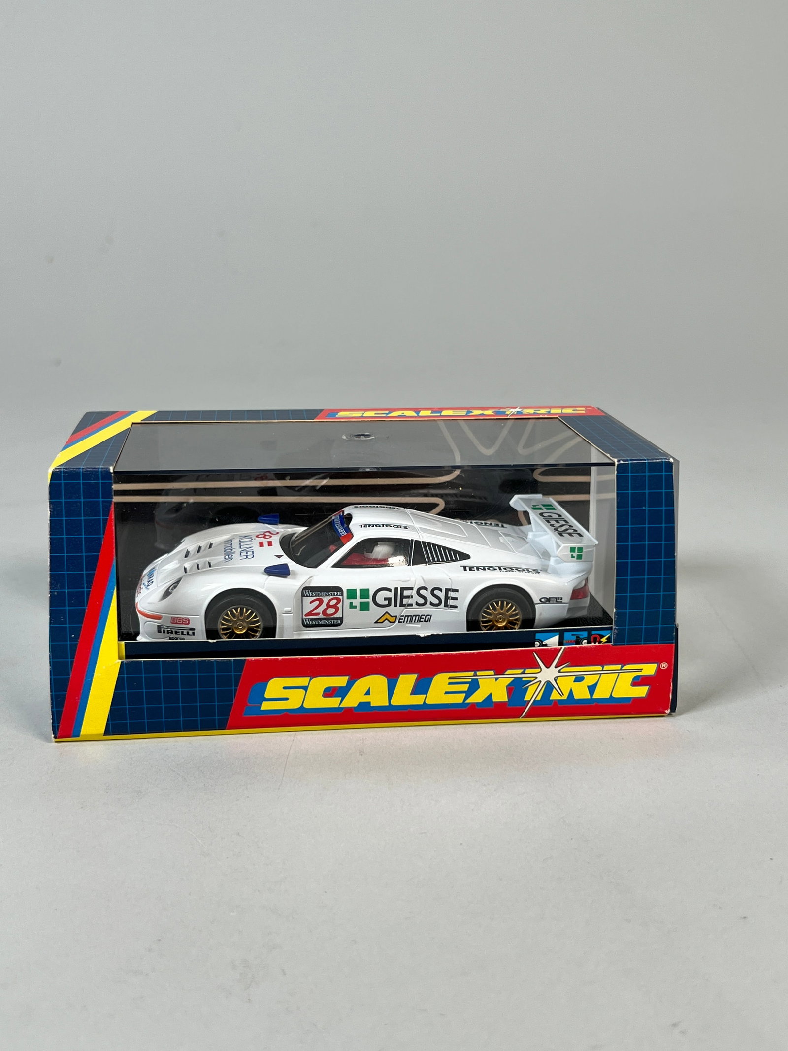 Scalextric Porsche 911 GT 1 Konrad #28: Scalextric Porsche 911 GT 1 Konrad #28 Giesse 1/32 Slot Car, in its original packaging. Dimensions: 3.5" x 7" x 3.5". Weight: 6oz.