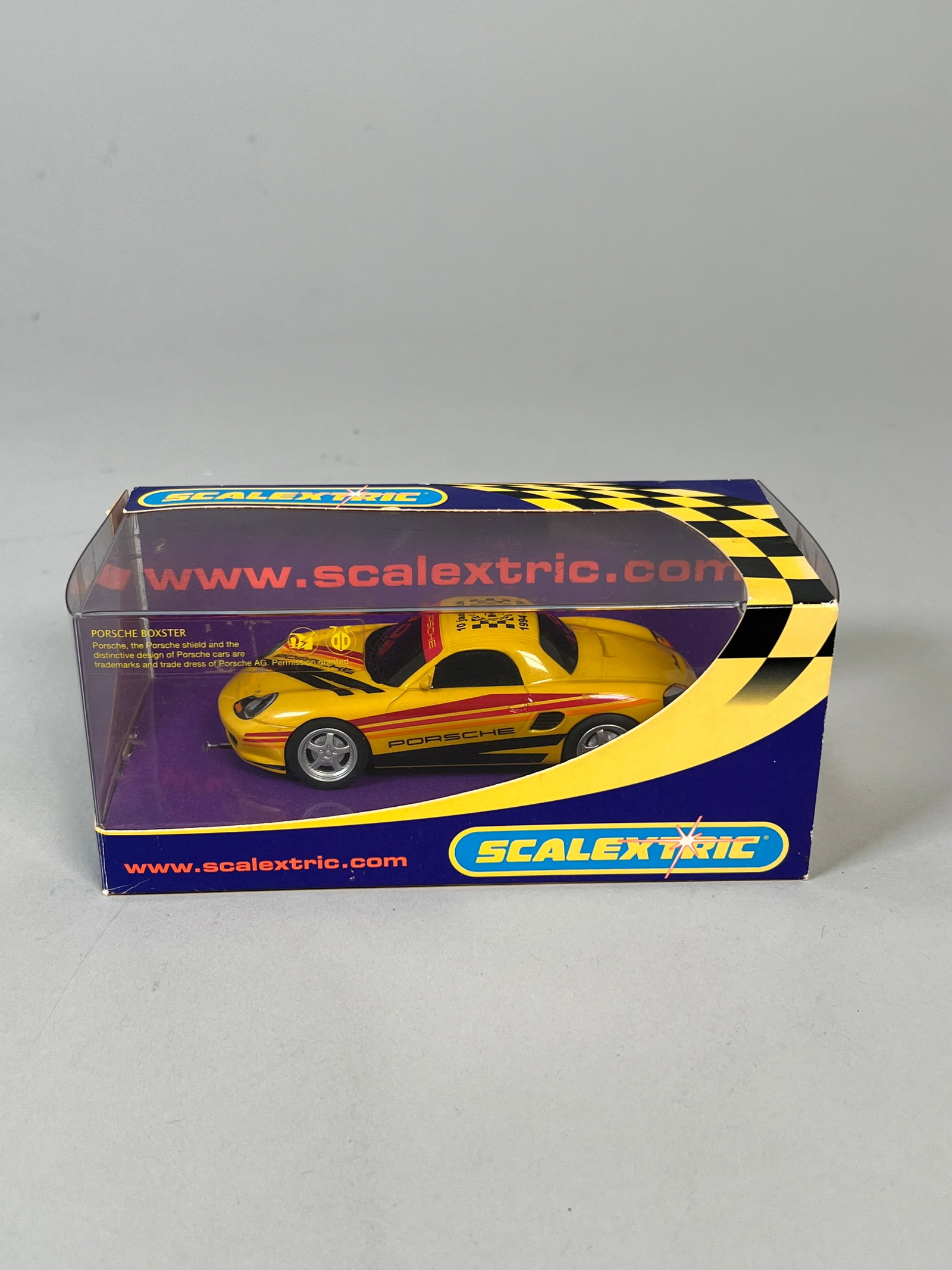 Scalextric Porsche Boxster Yellow '04 1/32 Slot Car: Scalextric Porsche Boxster Yellow '04 1/32 slot car, model number C2479, in original packaging. Weight 5 oz. Dimensions: 3.75'' x 7.25'' x 3.75''. 