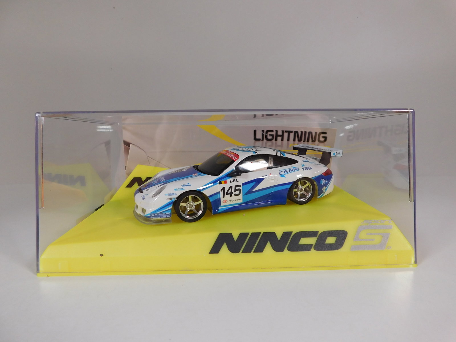 Ninco Sport Porsche 997 GT3 First Lightning #145: Ninco Sport Porsche 997 GT3 First Lightning #145 Total 1/32 Slot Car. Reference #50589, with original case. Weight: 9.1 oz.