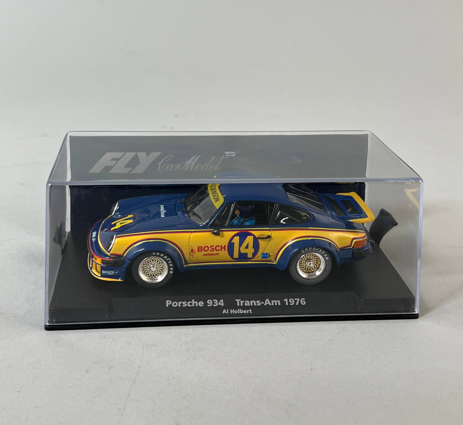 Fly Car Model Porsche 934 Trans-Am 1976 #14: Fly Car Model Porsche 934 Trans-Am 1976 #14 Bosch 1/32 Scale Slot Car. The car measures approximately 6 5/8" x 3 1/2" x 2 5/8" and weighs 6.5oz. It comes in its original display case.