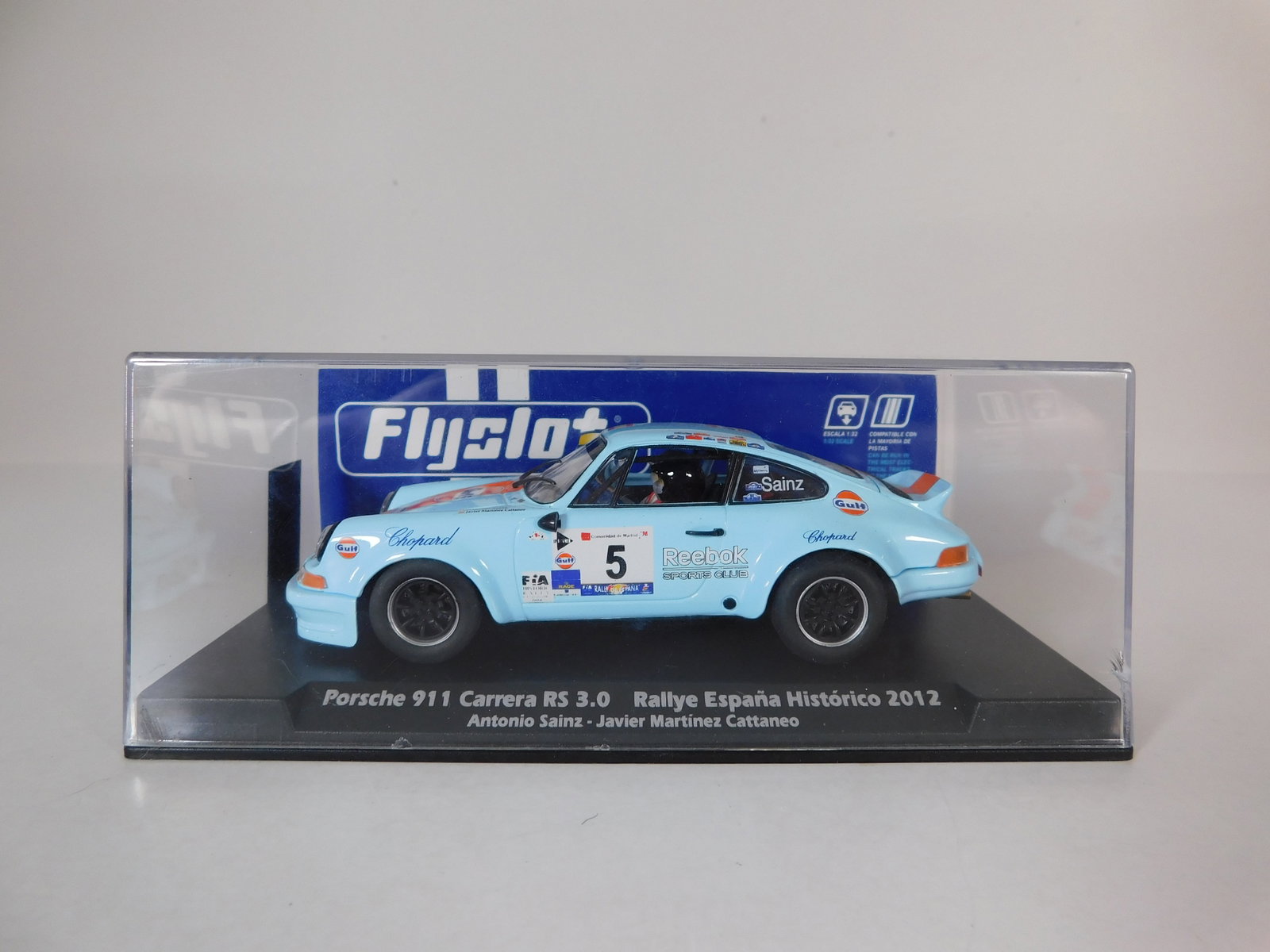 Flyslot Porsche 911 Carrera RS 3.0 Rallye EspaÃ±a HistÃ³rico 2012 #5: Flyslot Porsche 911 Carrera RS 3.0 Rallye España Histórico 2012 Sainz - Cattaneo #5 Gulf 1/32 Slot Car. Reference #036104, with original case. Weight: 6.4 oz.