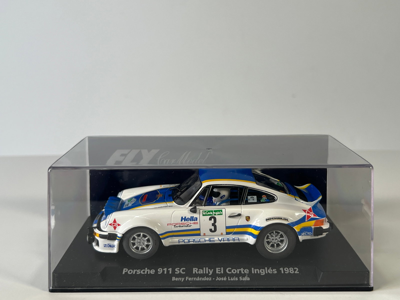Fly Car Model Porsche 911 SC Rally El Corte Inglés 1982 #3: Fly Car Model Porsche 911 SC Rally El Corte Inglés 1982 Fernandez - Sala #3 Turbomotor 1/32 Slot Car, A-963. Reference #88153, with original case. Case length: 6.5 inches. Weight: 7 oz.