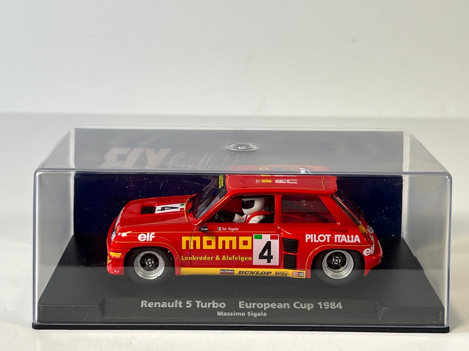 Fly Car Model Renault 5 Turbo European Cup 1984 #4: Fly Car Model Renault 5 Turbo European Cup 1984 Massimo Sigala #4 Momo 1/32 Slot Car, A-1205. Reference #88188, with original case. Weight: 7 oz.