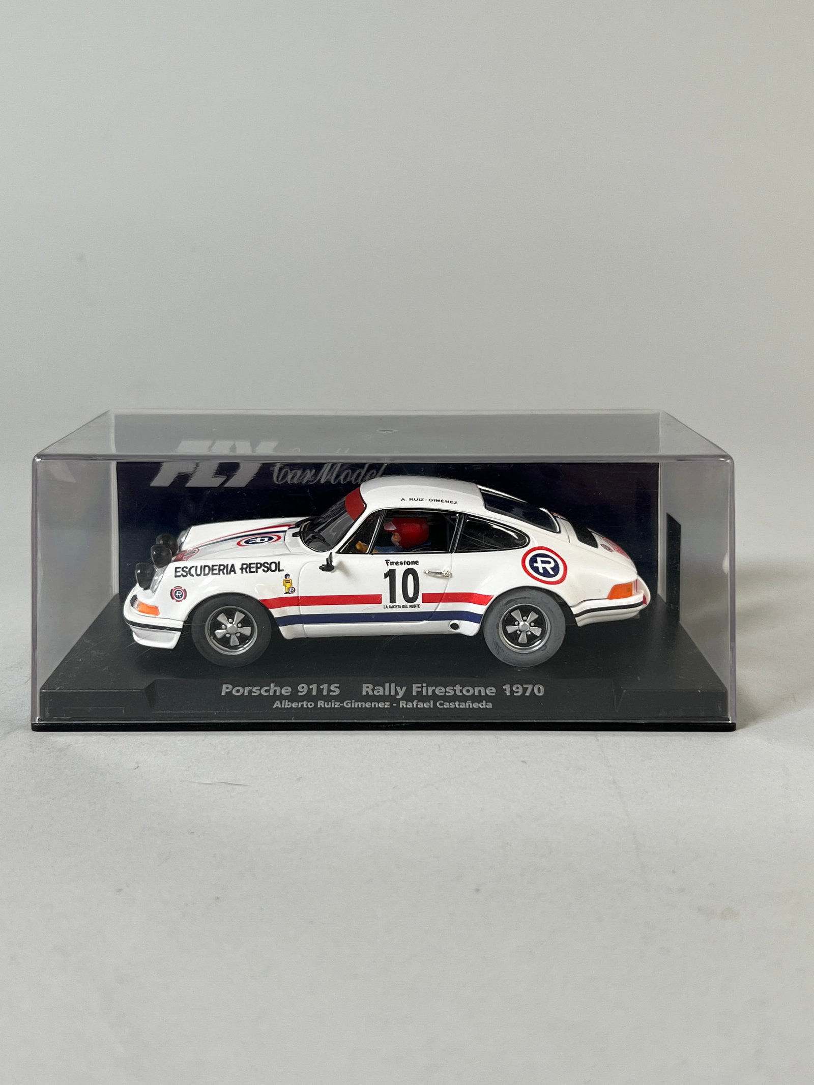 Fly Car Model Porsche 911S Rally Firestone 1970 #10: Fly Car Model Porsche 911S Rally Firestone 1970 #10 Escuderia Repsol 1/32 Slot Car. Reference #88145. Presented in original clear display case. Dimensions: 3" x 6.25" x 3.25". Weight: 6