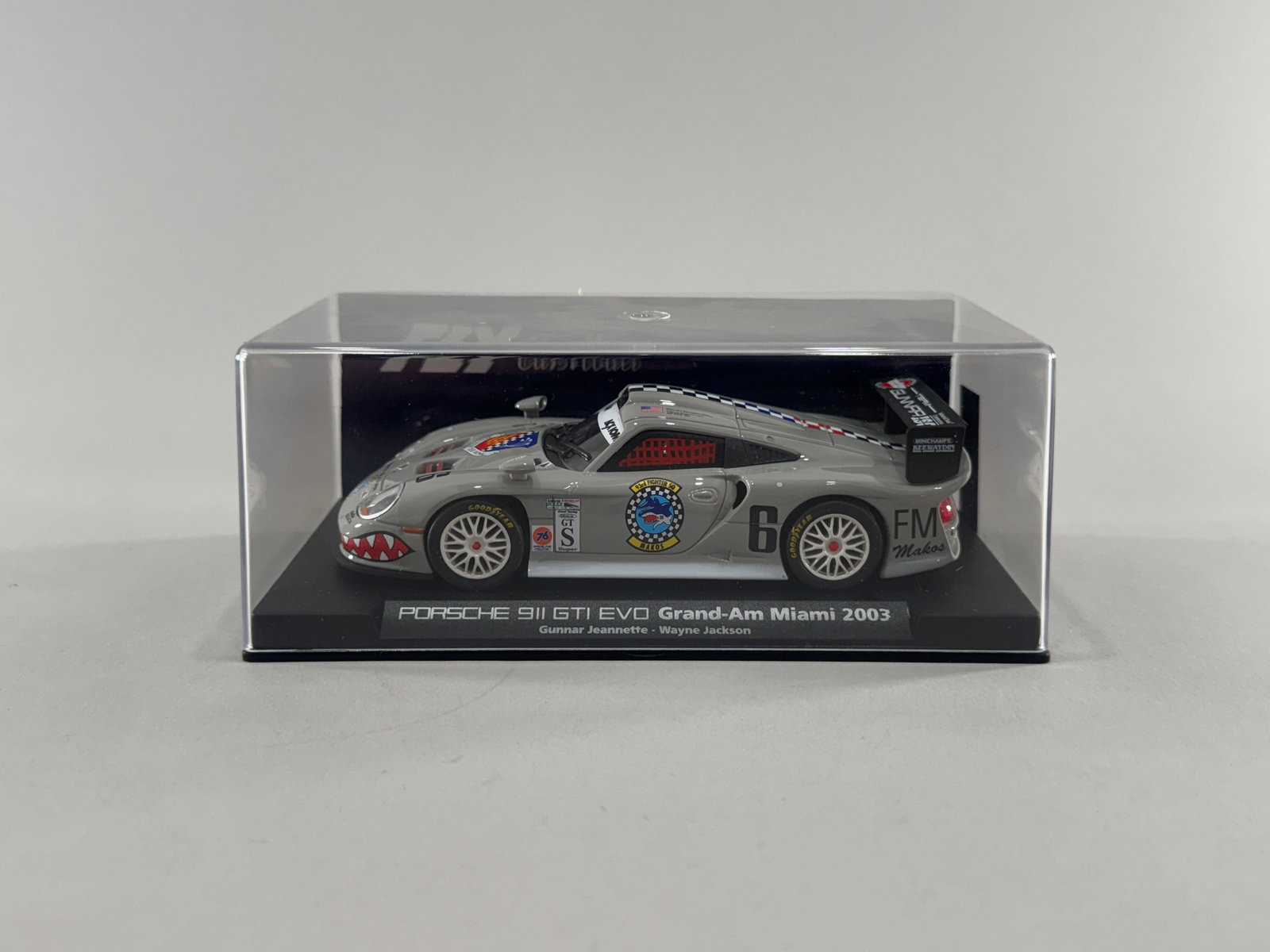 Porsche 911 GT1 EVO Grand-Am Miami 2003 #6: Porsche 911 GT1 EVO Grand-Am Miami 2003 #6 1/32 Slot Car. The model is presented in a clear display case. Weight: 7oz. 