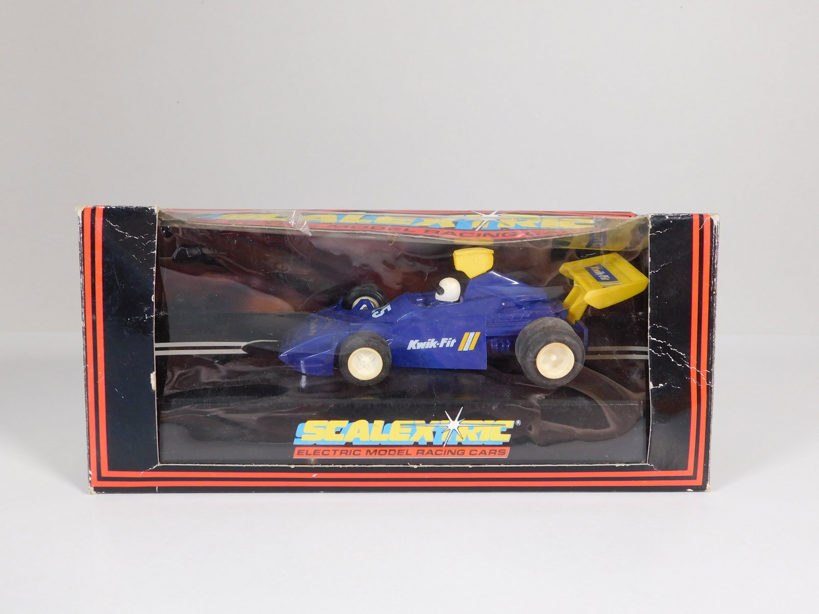 Scalextric Team Kwik-Fit 25th Anniversary #25: Scalextric FX Team Kwik-Fit 25th Anniversary #25 1/32 Slot Car, with original case. Weight: 4.1 oz. C.782