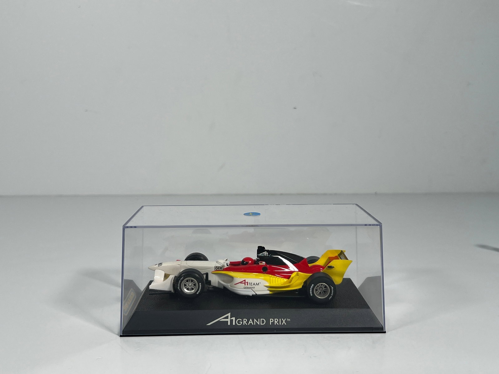 Scalextric A1 Grand Prix Team Germany: Scalextric A1 Grand Prix Team Germany 1/32 Slot Car, with original case. Weighs 6oz and measures approximately 3 x 7.25 inches.