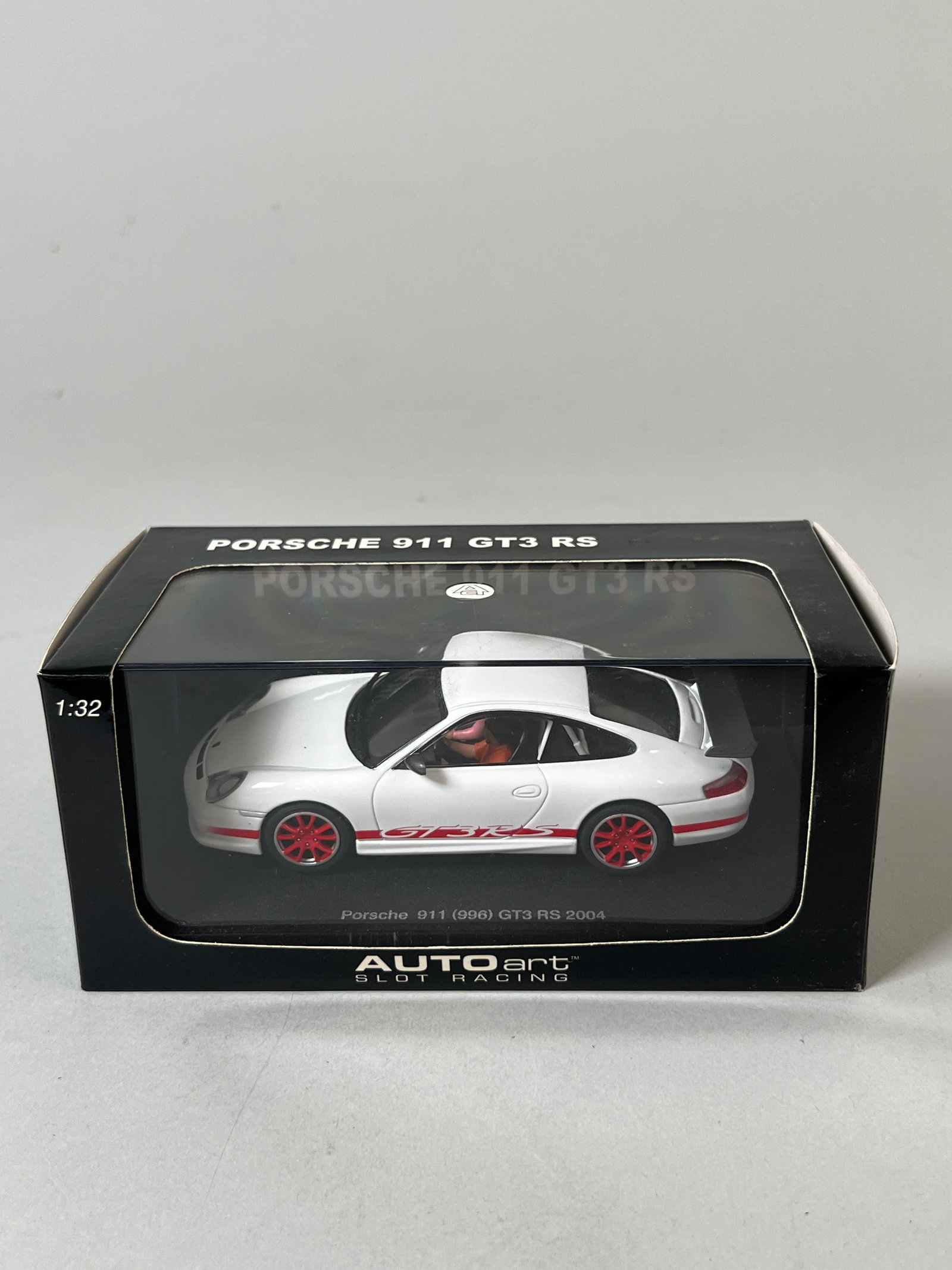 Autoart Porsche 911 GT3 RS: Autoart Porsche 911 GT3 RS 1/32 slot car, in its original packaging. Dimensions: 4'' x 7.5'' x 3.75''. Weight: 10.2oz.