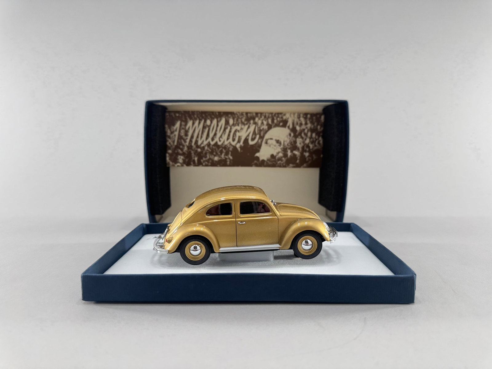 Pink-Kar VW Beetle 1,000,000 Gold: Pink-Kar VW Beetle 1,000,000 Gold 1/32 Slot Car, with original case. Box measures 7 3/4'' x 5 1/8'' x 2 1/2''. Weight: 7.2 oz.