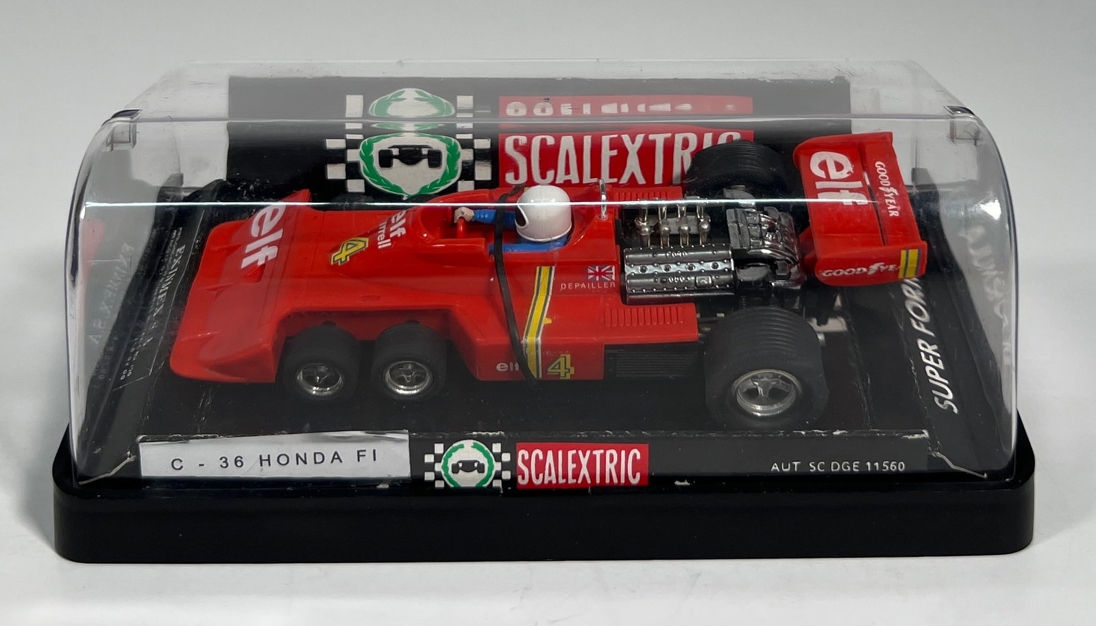 Scalextric C-36 Honda F1 #4: Scalextric C-36 Honda F1 #4 Elf 1/32 Slot Car - Super Formula. AUT SC DGE 11560, with original case. Weight: 7oz.