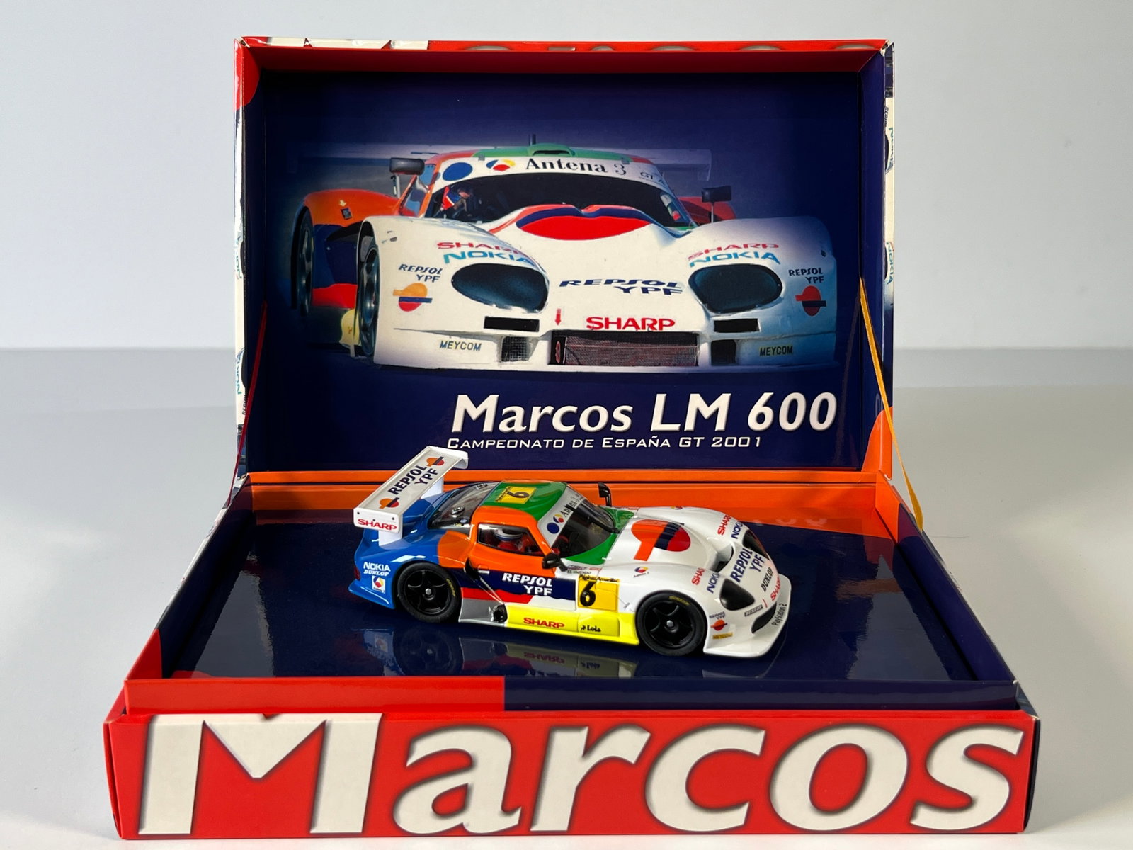 Fly Car Model Marcos LM 600 Campeonato de España GT 2001 #6: Fly Car Model Marcos LM 600 Campeonato de España GT 2001 Saldana - Burgueno #6 Paginas Amarillas 1/32 Slot Car. Reference #A28, with original case. Weight: 10 oz.