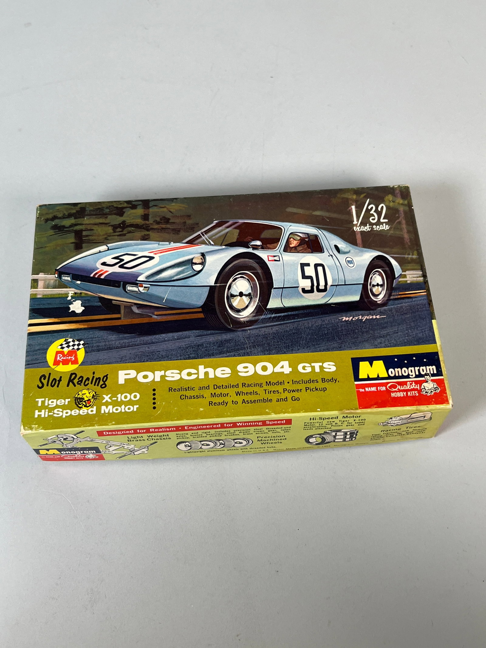 Monogram Slot Racing Porsche 904 GTS #5: Monogram Slot Racing Porsche 904 GTS #50 1/32 Slot Car. The original box is present and shows some wear. The slot car itself appears to be in good condition. Weight: 8.6oz. Dimensions: 6.25'&