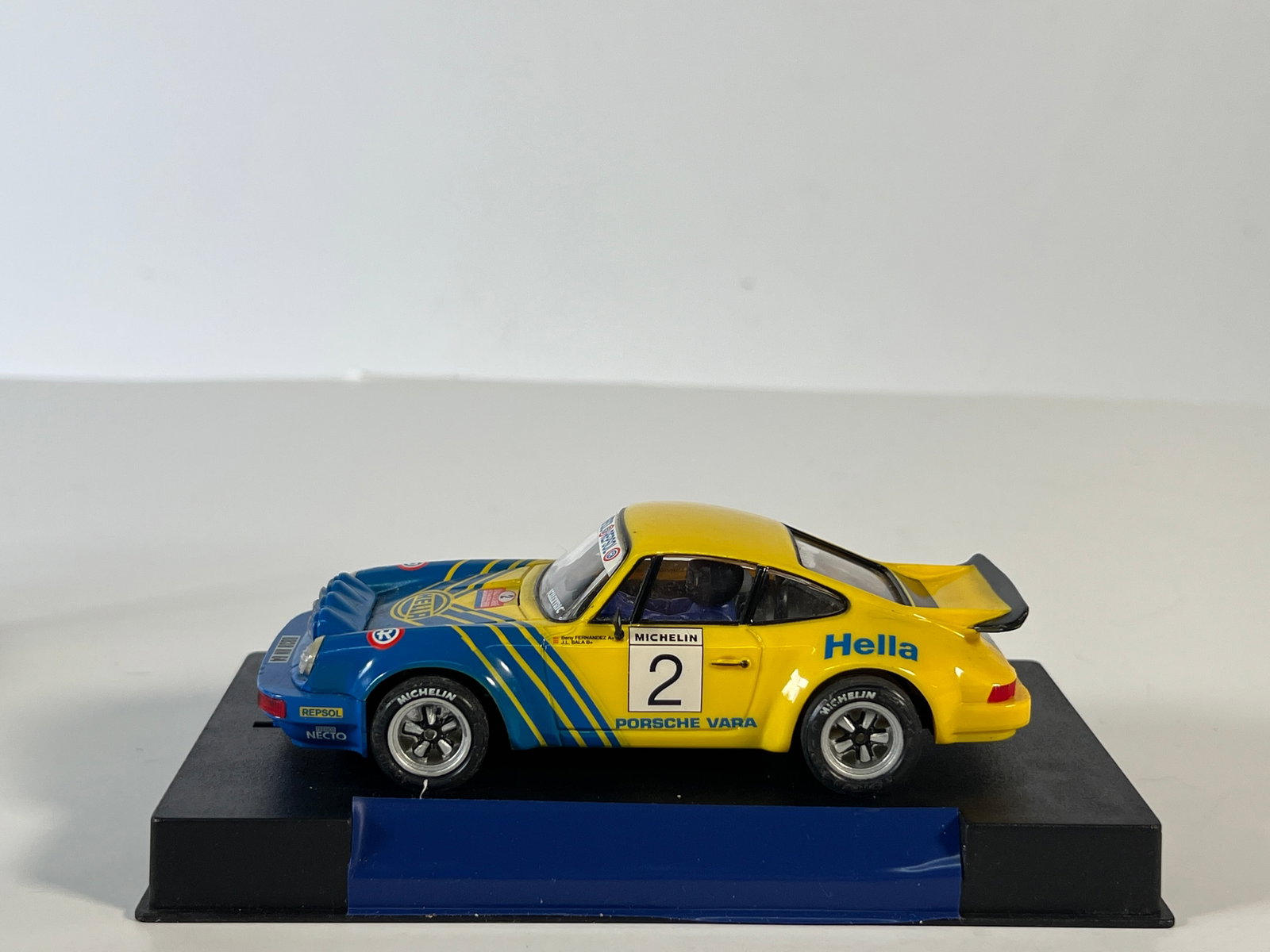 Porsche Vara #2: Porsche Vara #2 Hella 1/32 Slot Car, with original case. The case measures 6.25 inches in length and the item weighs 7 oz.