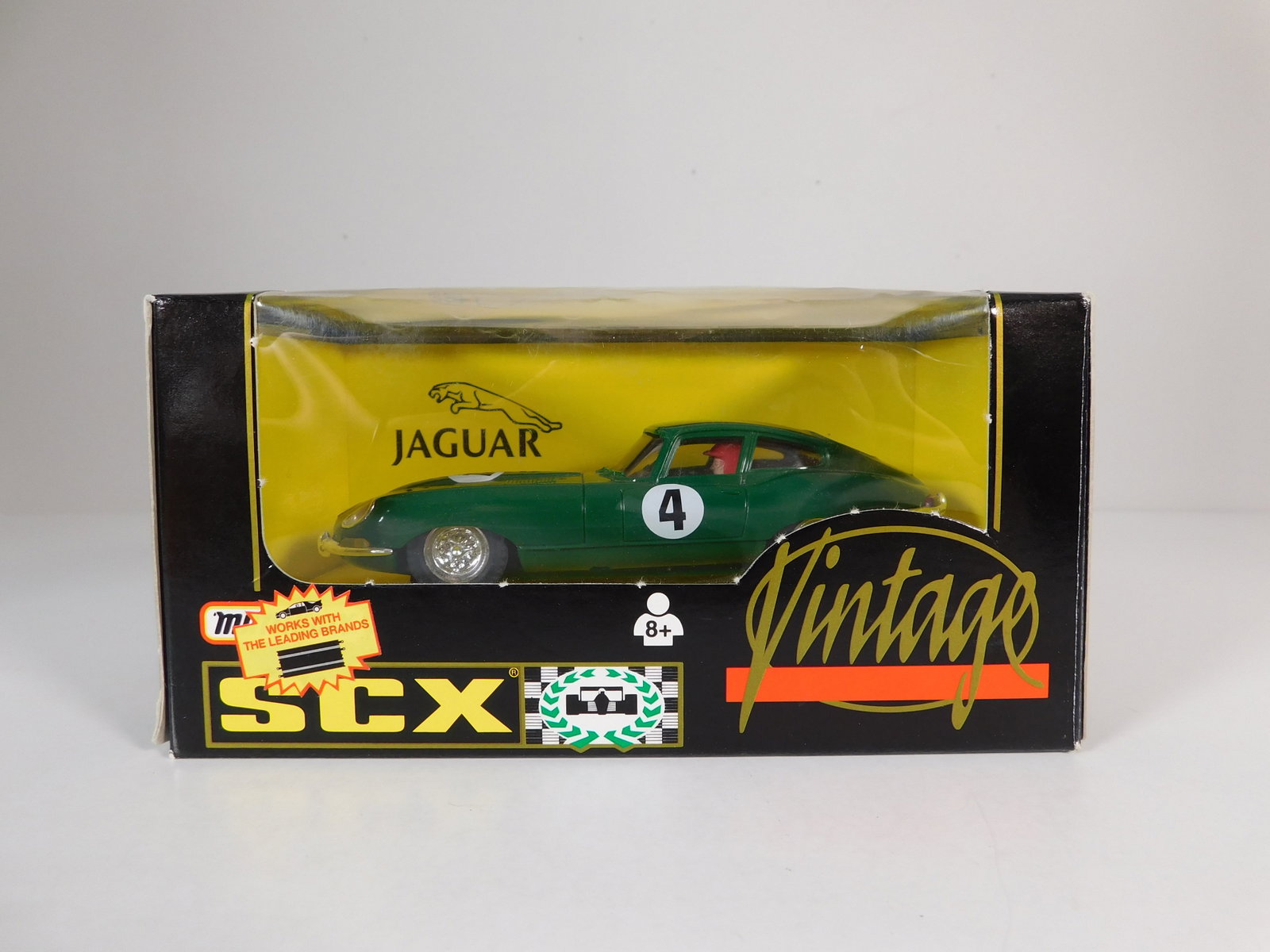 SCX Vintage Jaguar-E #4: SCX Vintage Jaguar-E #4 1/32 Slot Car. Reference #83710, with original case. Weight: 5.5 oz.