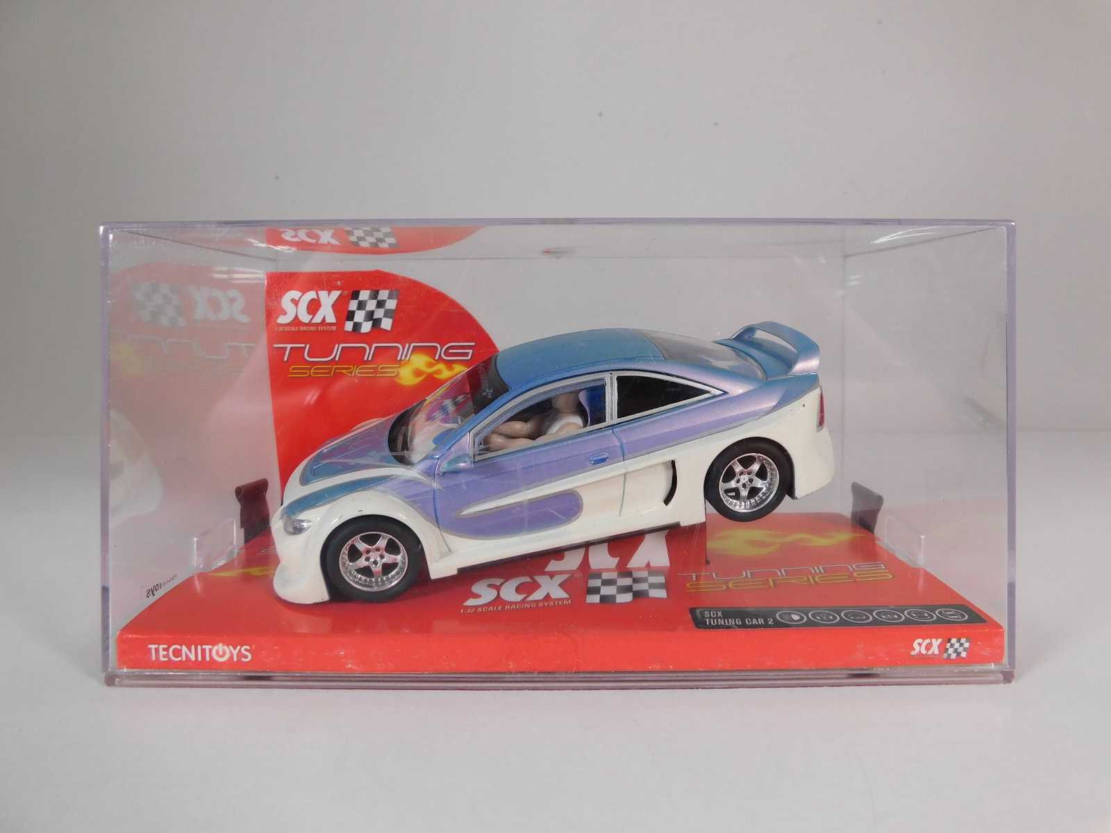 SCX Tuning Car 2: SCX Tuning Car 2 1/32 Slot Car. Reference #61980, with original case. Weight: 8.2 oz.