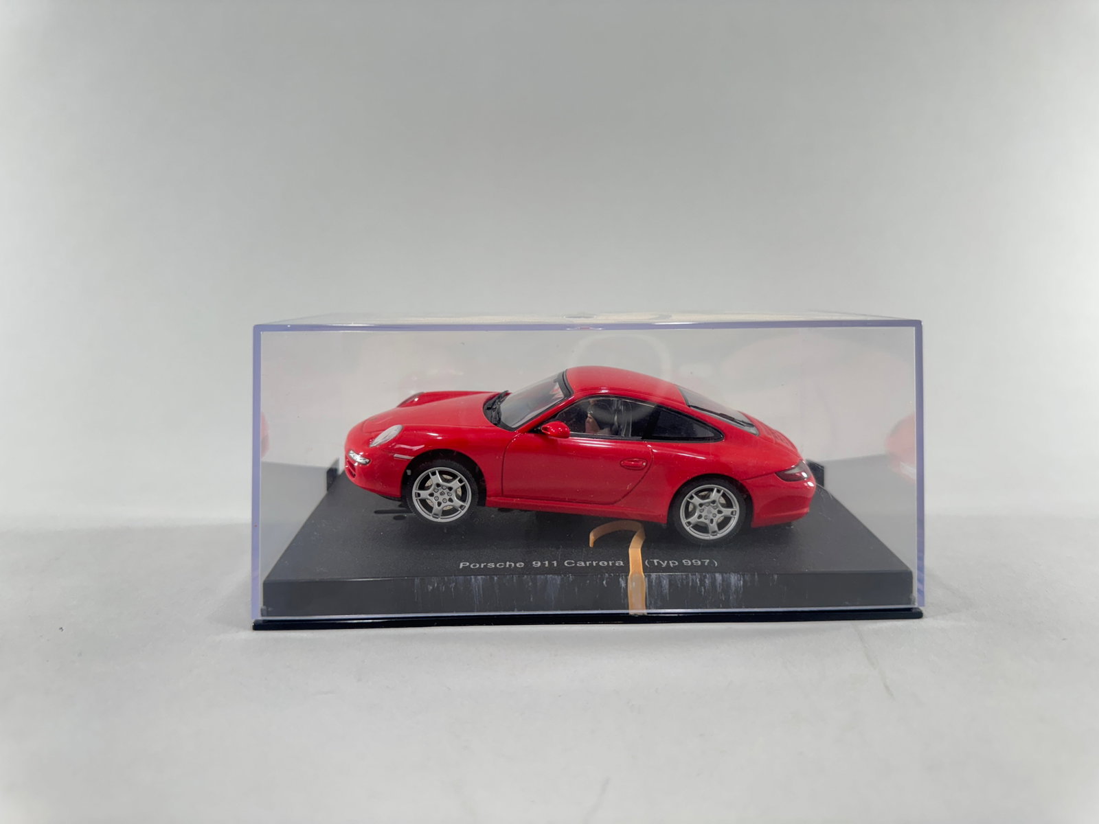 Autoart Porsche 911 Carrera (Typ 997): Autoart Porsche 911 Carrera (Typ 997) 1/32 Slot Car, with original case. Dimensions: 6 15/16'' x 4 7/8'' x 3''. Weight: 8.6oz. 