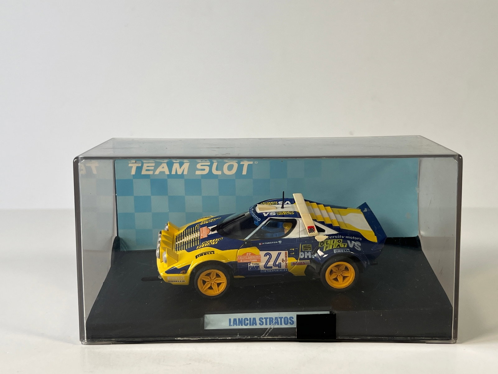 Team Slot Lancia Stratos Olio Fiat #24: Team Slot Lancia Stratos Olio Fiat #24 1/32 Slot Car. Reference #11504, with original case. Case measures 7 inches in length and the total weight is 10 oz.