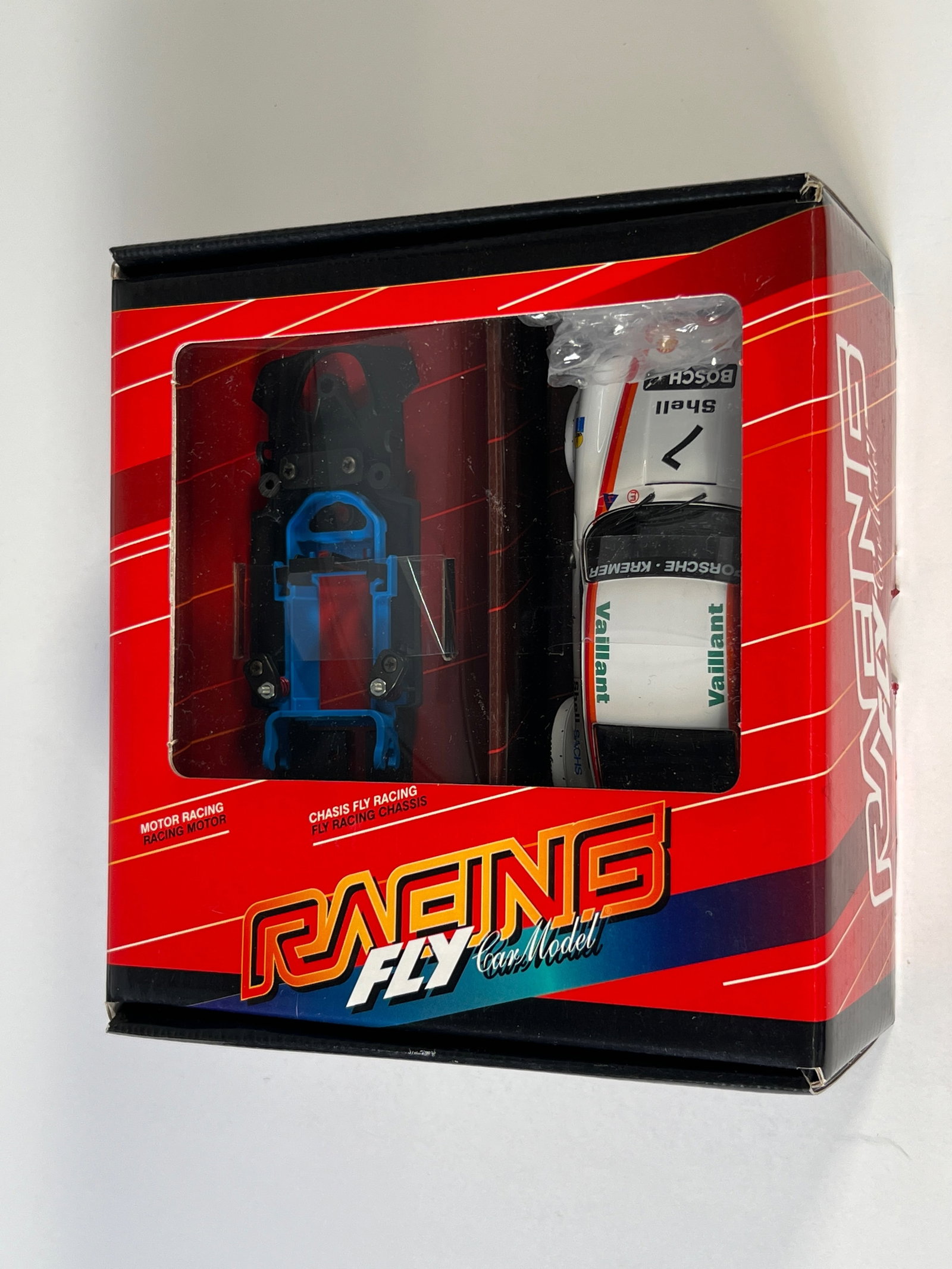 Fly Car Model Porsche Motor & Chassis Kit #7: Fly Car Model Porsche Motor & Chassis Racing #7 Shell - Vaillant 1/32 Slot Car, with original case. Case length: 7.25 inches. Weight: 9 oz.