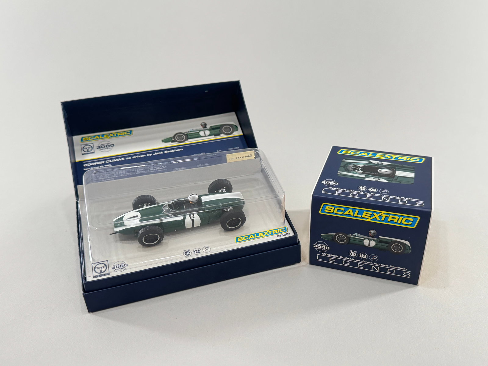 Scalextric Legends Cooper Climax #1: Scalextric Legends Cooper Climax #1 1/32 Slot Car. The car is in its original box. Dimensions: 7 1/8'' x 3 3/4'' x 2 3/4''. Weight: 6.6oz. Limited edition #1311/3000