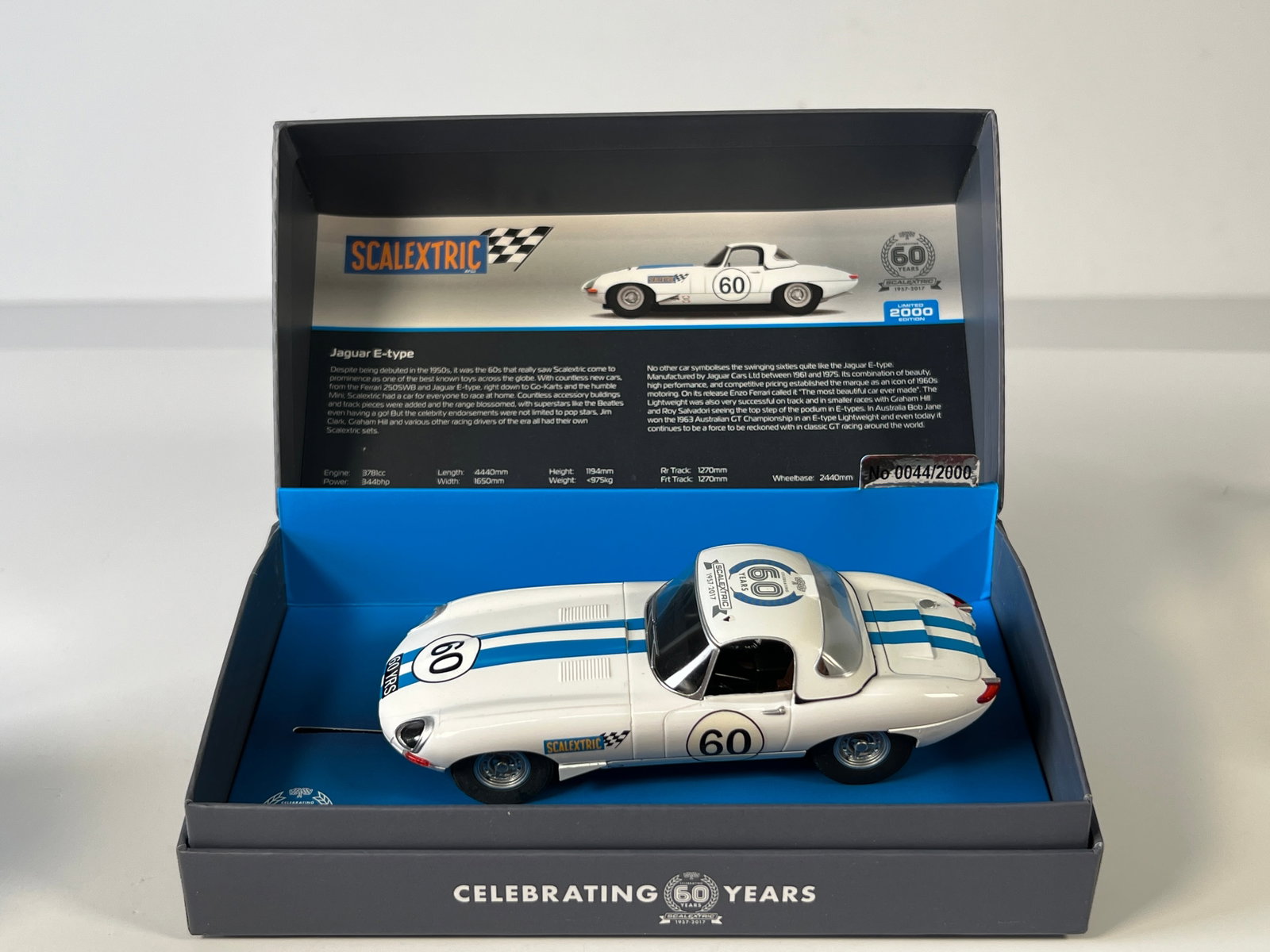 Scalextric Jaguar E-Type #60: Scalextric Jaguar E-Type #60 Celebrating 60 Years 1/32 Slot Car, with original case. Weight: 8 oz. Limited edition #0044/2000