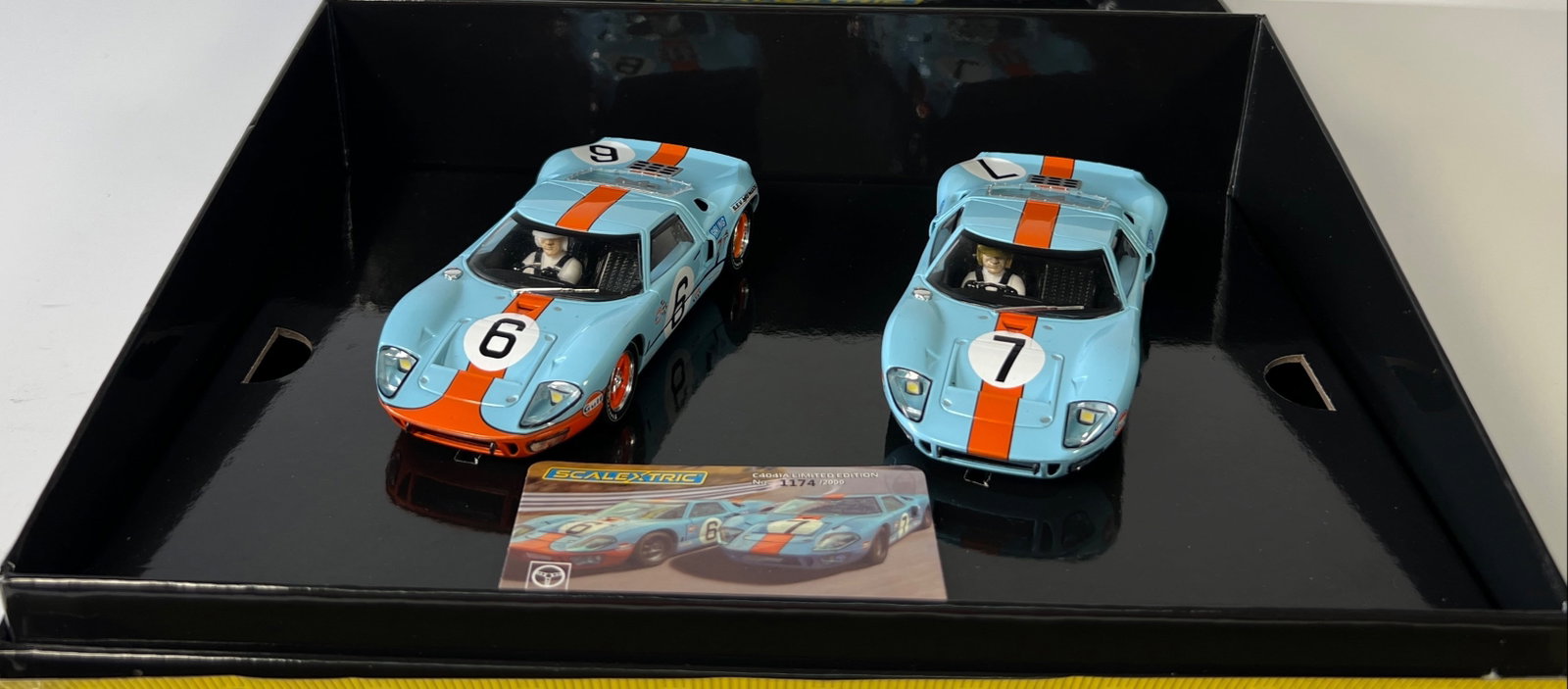 Scalextric 1969 Le Mans Ford GT40 Slot Car Set: Scalextric 1969 Le Mans Ford GT40 Gulf Twin Pack Legends #6 #7 1/32 Slot Car set, with original case. Case length: 11.25 inches. Weight: 23 oz. Limited edition #1174/2000.