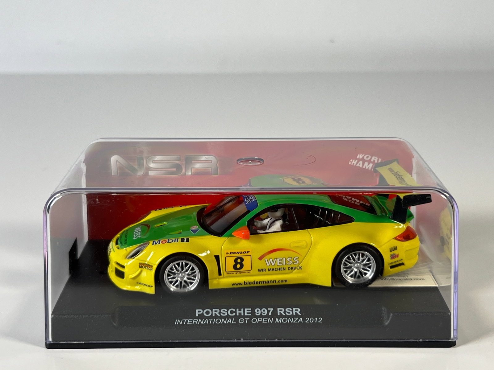 NSR Porsche 997 RSR International GT Open Monza 2012 #8: NSR 1160 Porsche 997 RSR International GT Open Monza 2012 #8 Weiss 1/32 Slot Car, with original case. Weight: 7.5 oz.