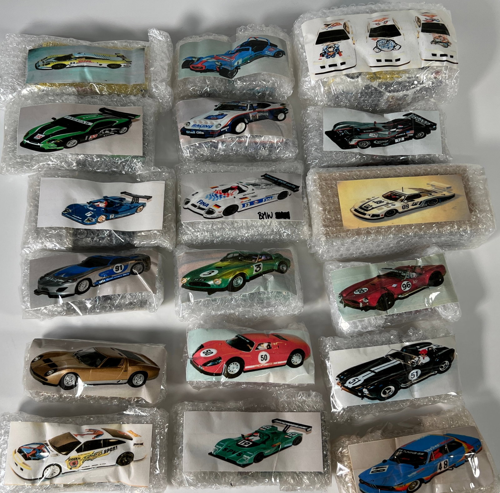 Twenty Loose 1/32 Scale Slot Cars: A lot of twenty assorted slot cars from Nick's extensive collection. Various makes and models are represented. Photos match the cars in bubble wrap. Additional packaging is not included. Cars are 
