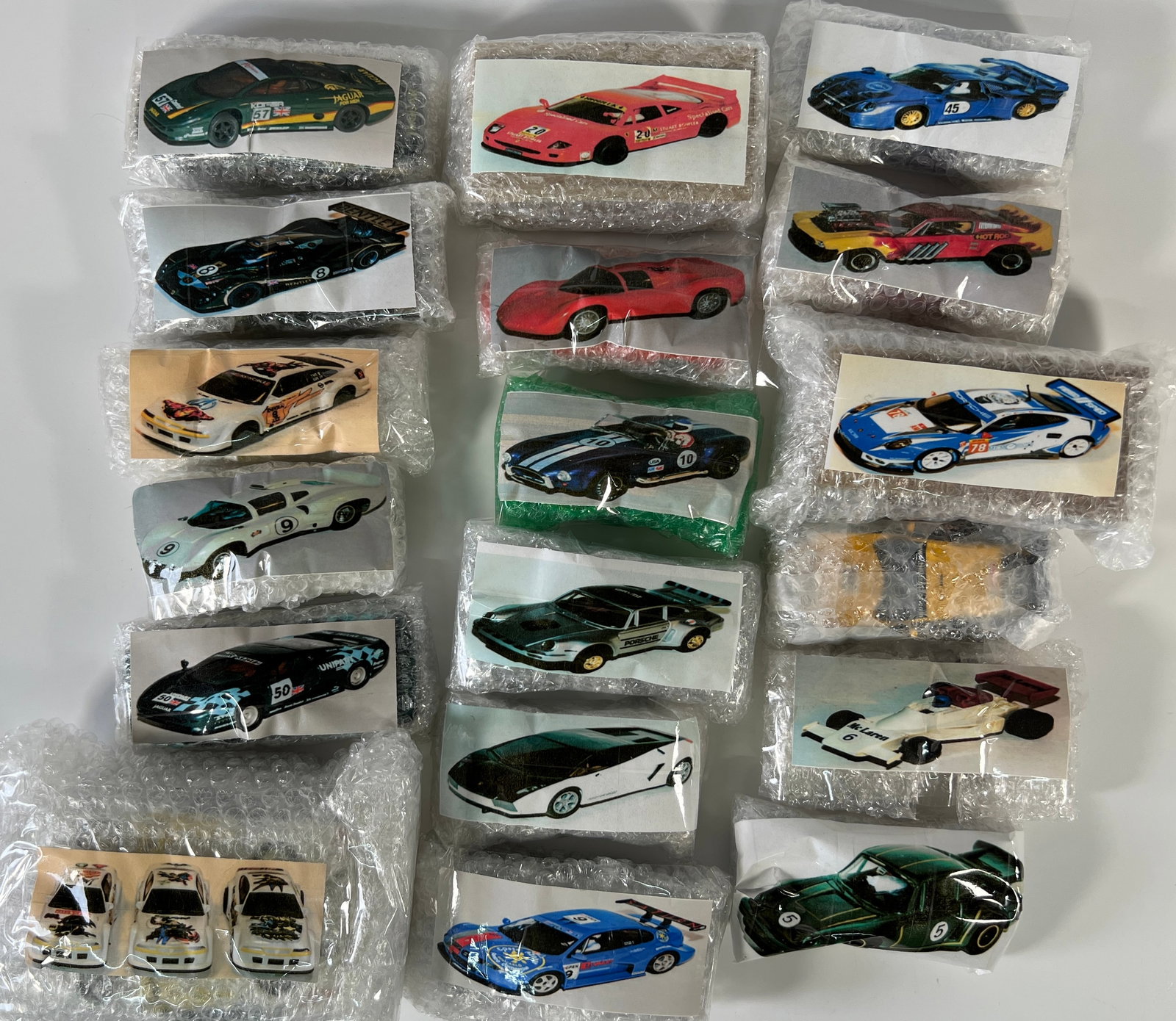 Twenty Loose 1/32 Scale Slot Cars: A lot of twenty assorted slot cars from Nick's extensive collection. Various makes and models are represented. Photos match the cars in bubble wrap. Additional packaging is not included. Cars are 