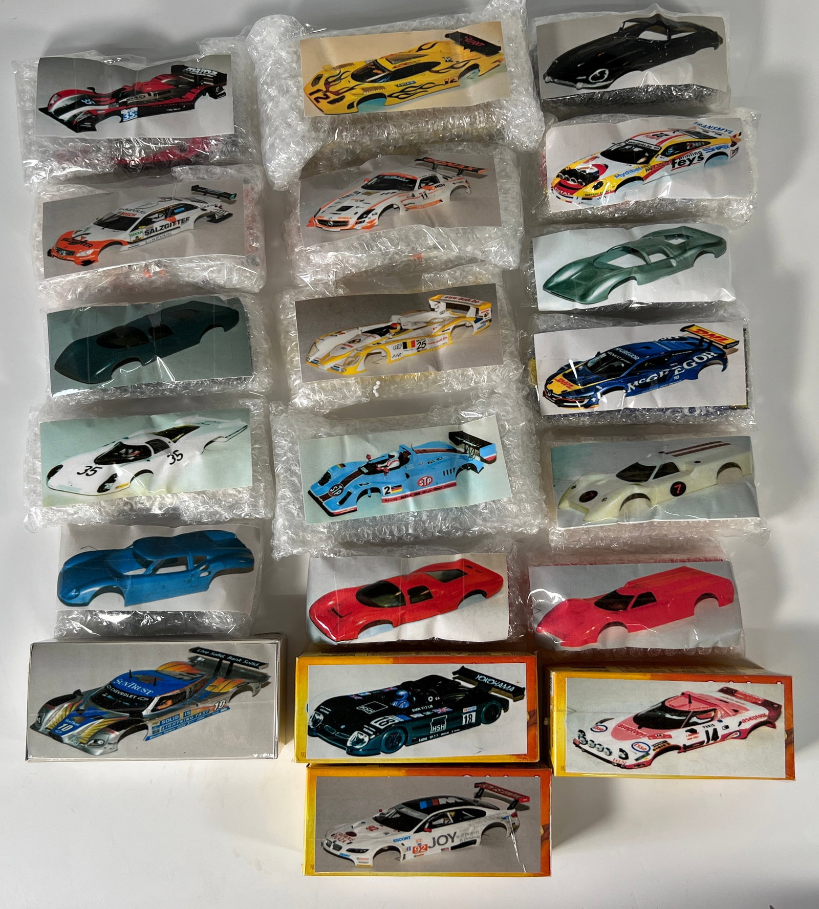1/32 Scale Slot Car Chassis - 20 Pieces: A lot of twenty assorted slot car chassis from Nick's extensive collection. Various makes and models are represented. Photos match the chassis in bubble wrap. Additional packaging is not incl
