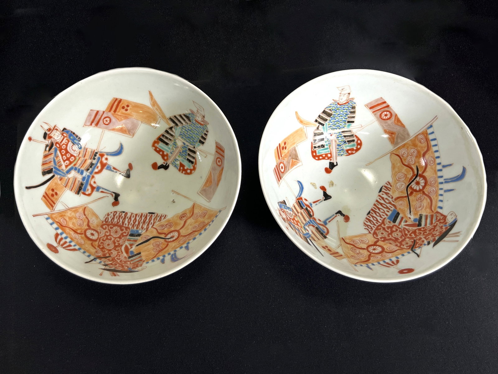 Two Japanese Hichozan Fukagawa Bowls with Samurai Motif: Two Japanese Hichozan Fukagawa Bowls with Samurai Motif, marked on bottom (see photos for details). Each bowl measures approximately 3.75'' in height and 8.75'' in diameter. Weighs