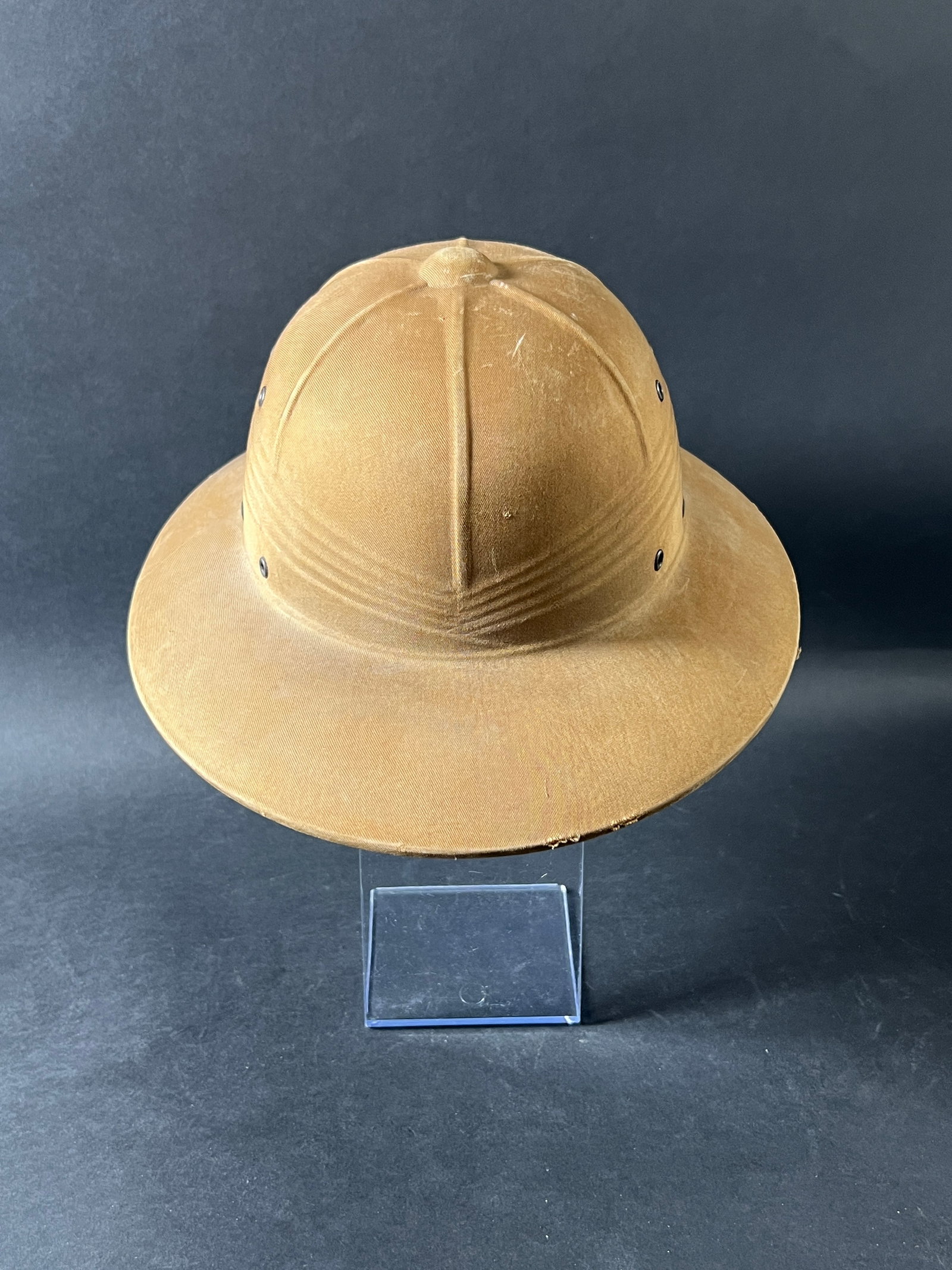 Vintage Pith Helmet: Vintage military pith helmet. Classic design with ventilation holes. Measures 13 inches wide and weighs 8 ounces.