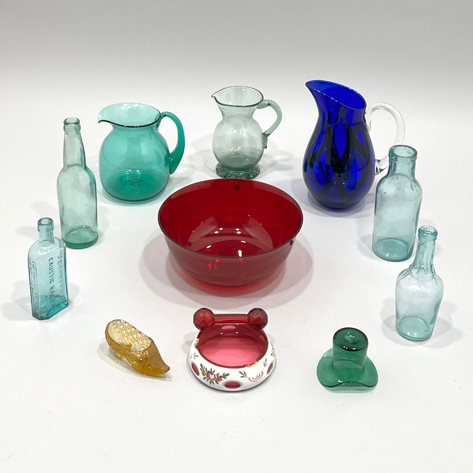Collection of Vintage Glassware and Bottles: This collection features a variety of vintage glass items. The tallest item measures approximately 10.5 inches. Weight: 12lb 15oz.