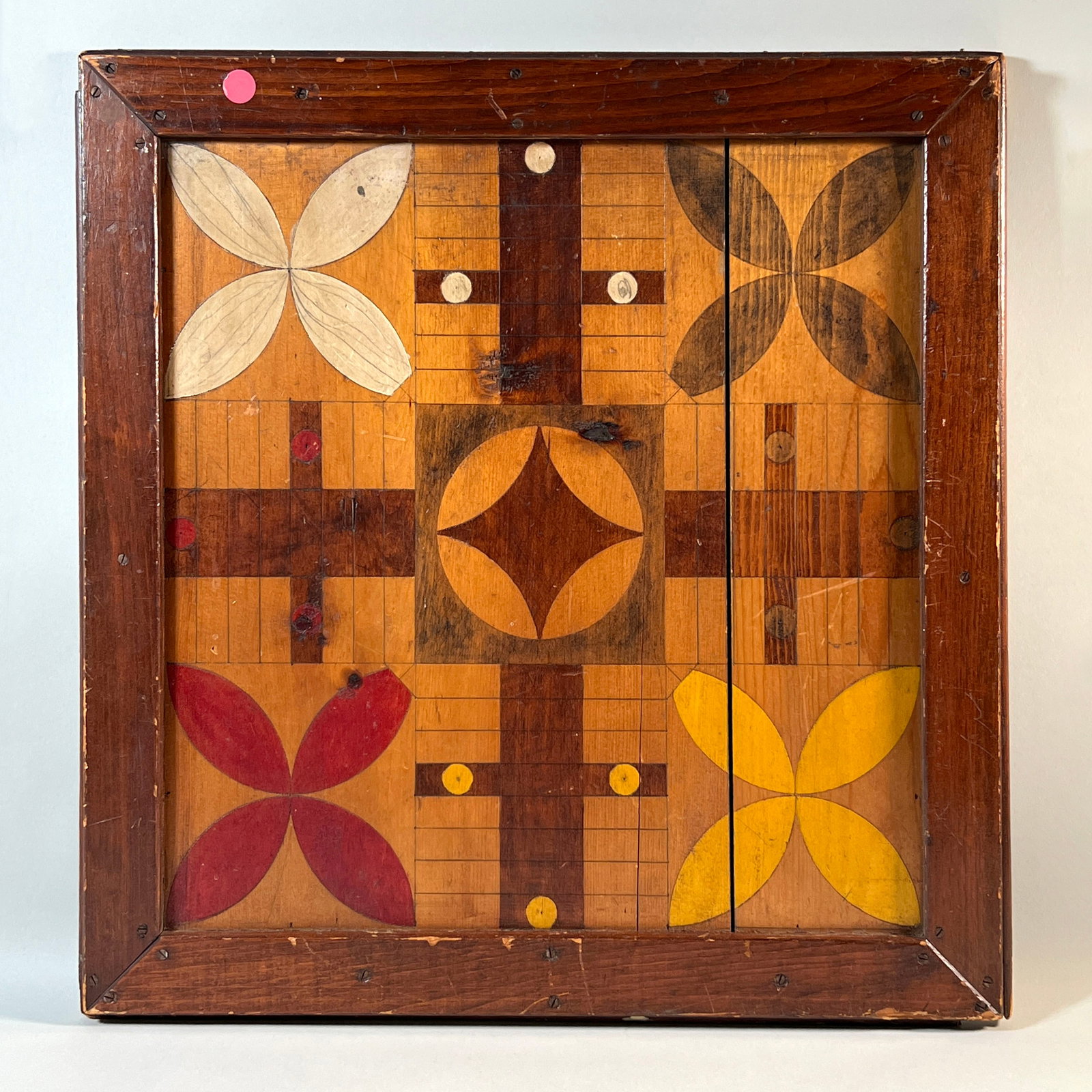 Folk Art Parcheesi Board: Nineteenth century hand-painted Parcheesi game board, with checkerboard on the other side. 20.5 inches in length weight: 2lb 14oz.