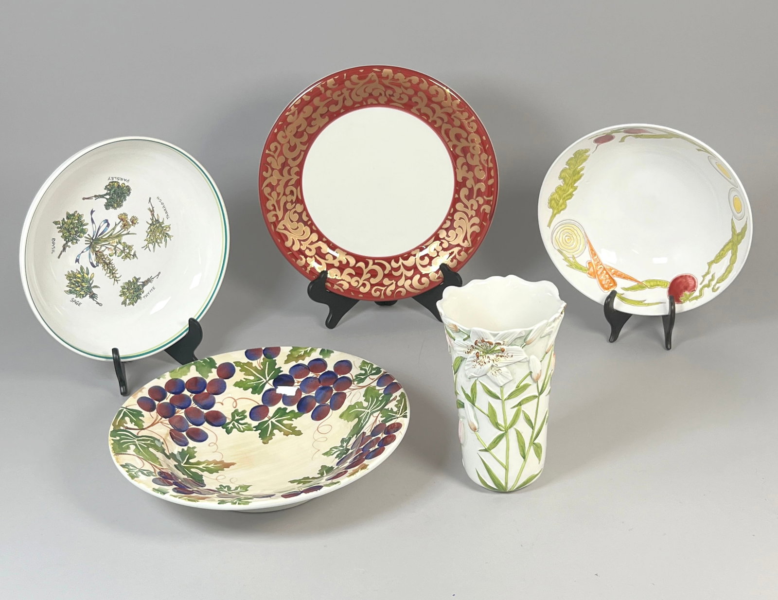 Collection of Italian Ceramic Plates and Vase: A collection of Italian ceramic decorative items, including 4 plates and one vase. The largest item measures 15.25 inches. Weight: 15lb 13oz. 