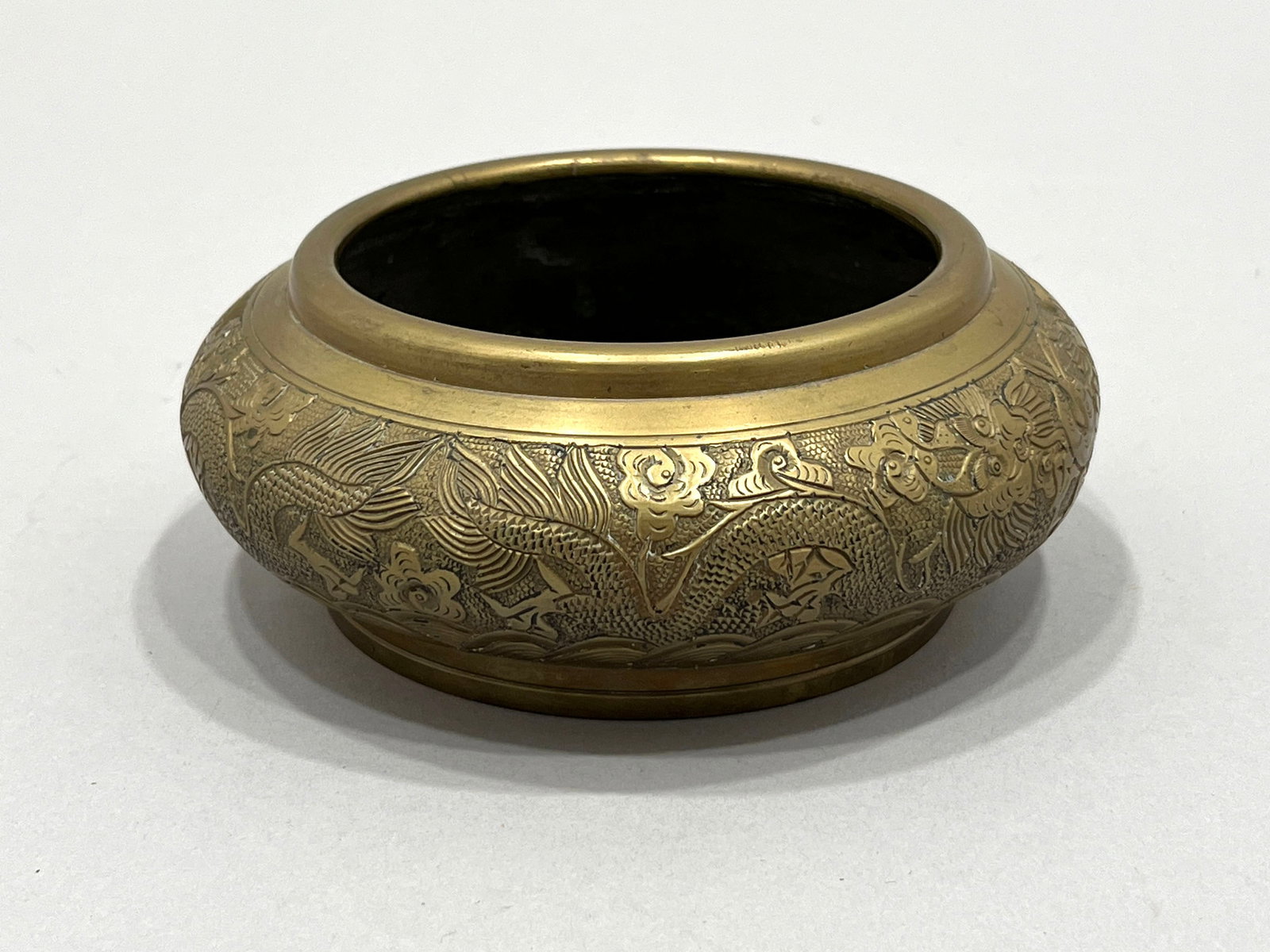 Antique Chinese Dragon Motif Bowl: Antique Chinese metal bowl, marked on underside. Diameter: 6.25 inches Weight: 3 lbs