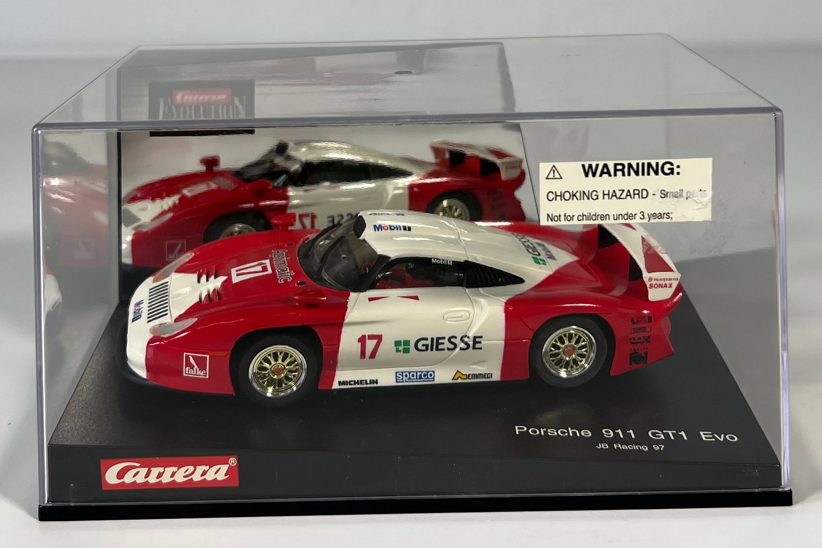 Carrera Evolution Porsche 911 GT1 Evo JB Racing 97 #17 1/32 Slot Car: Carrera Evolution Porsche 911 GT1 Evo JB Racing 97 #17 Giesse 1/32 Slot Car, with original case. Weight: 11.3 oz.