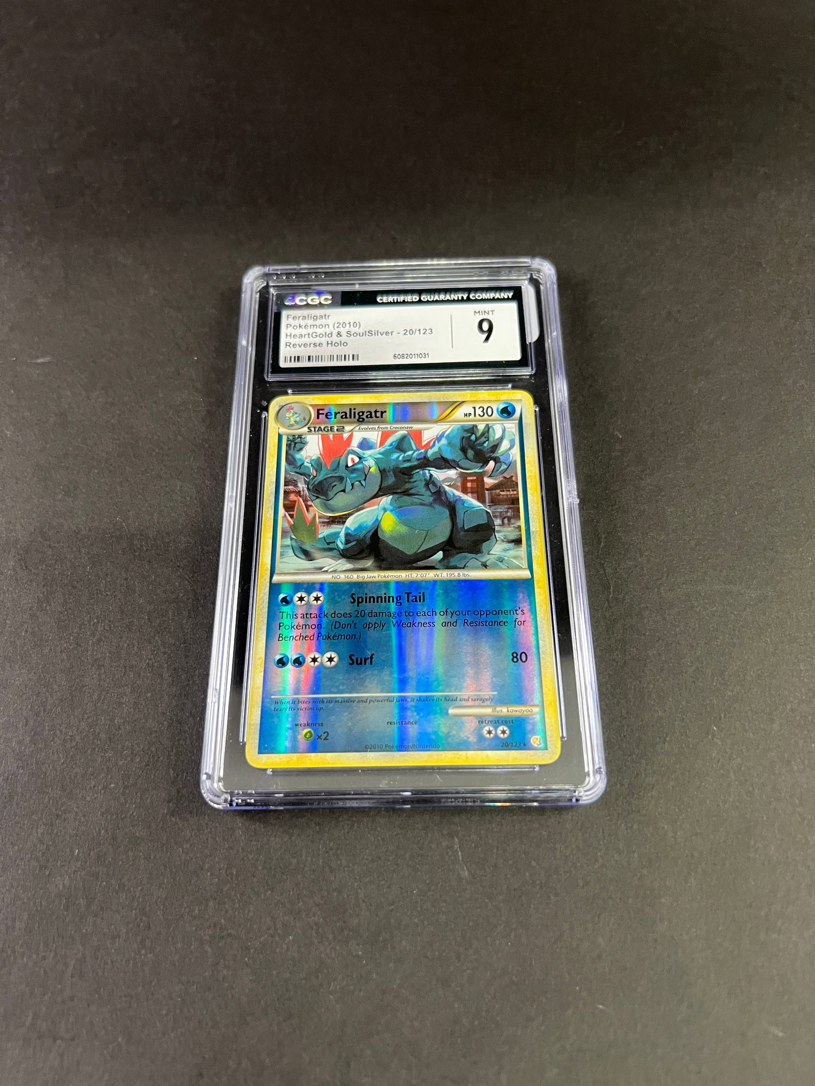 Pokemon TCG Feraligatr CGC 9: A graded Pokemon trading card featuring Feraligatr, from the HeartGold & SoulSilver set, graded a 9 by CGC.