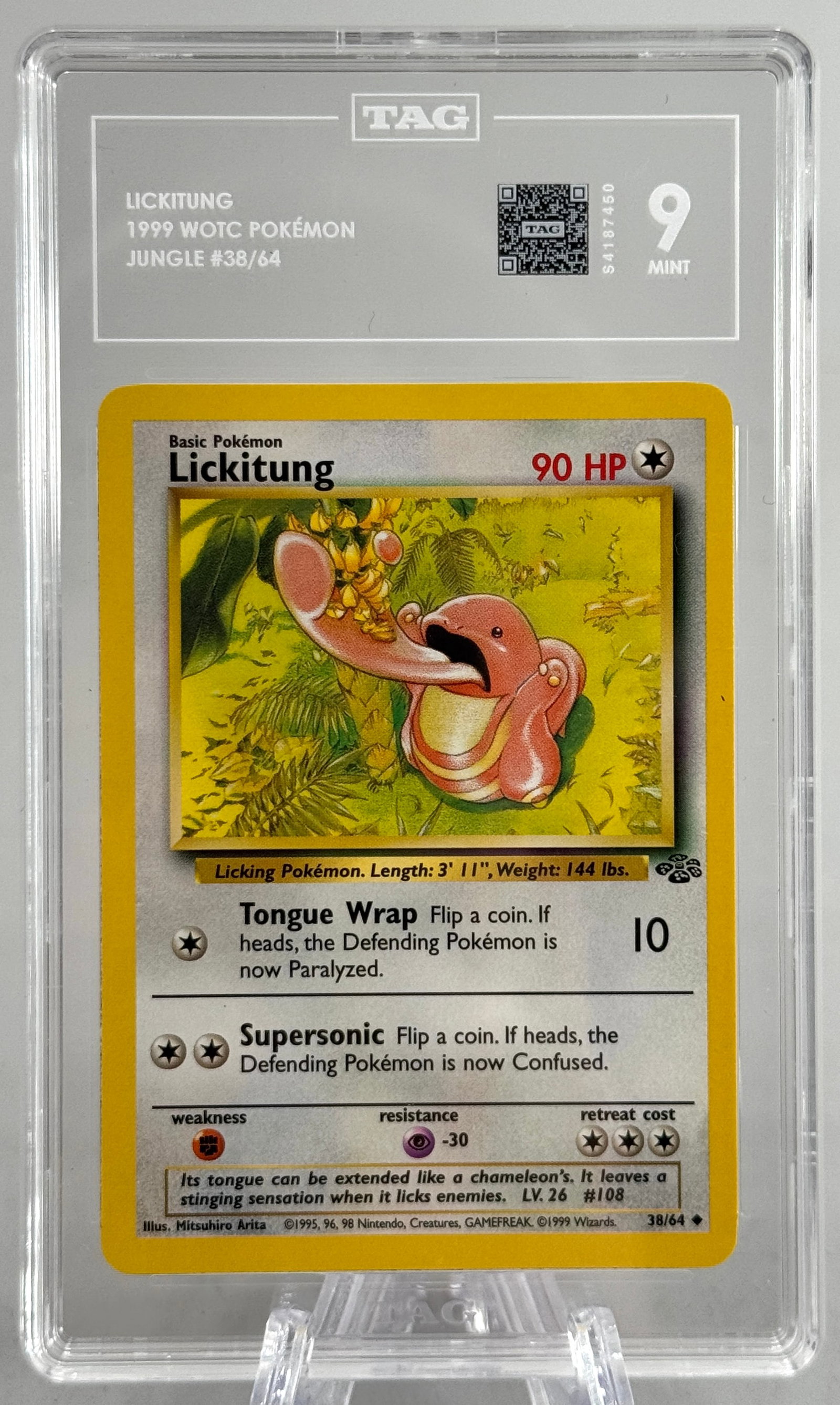 1999 Pokemon Lickitung #38/64 TAG Grading 9: 1999 WOTC Pokemon card featuring Lickitung, card number 38/64. Professionally graded by TAG Grading, receiving a grade of 9. Encapsulated for protection.