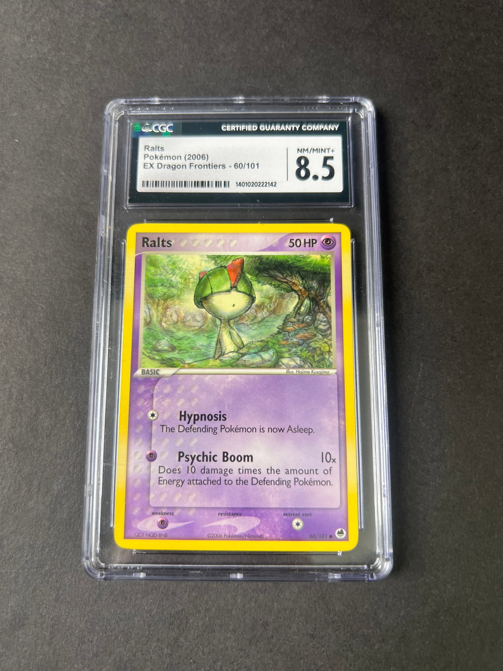 Ralts - EX Dragon Frontiers - Pokemon Card - CGC 8.5: Ralts Pokemon card from the EX Dragon Frontiers set, graded 8.5 by CGC. Card is encased in a protective holder. Dimensions approximately 10 x 8 cm. Weight: 2.1 oz.