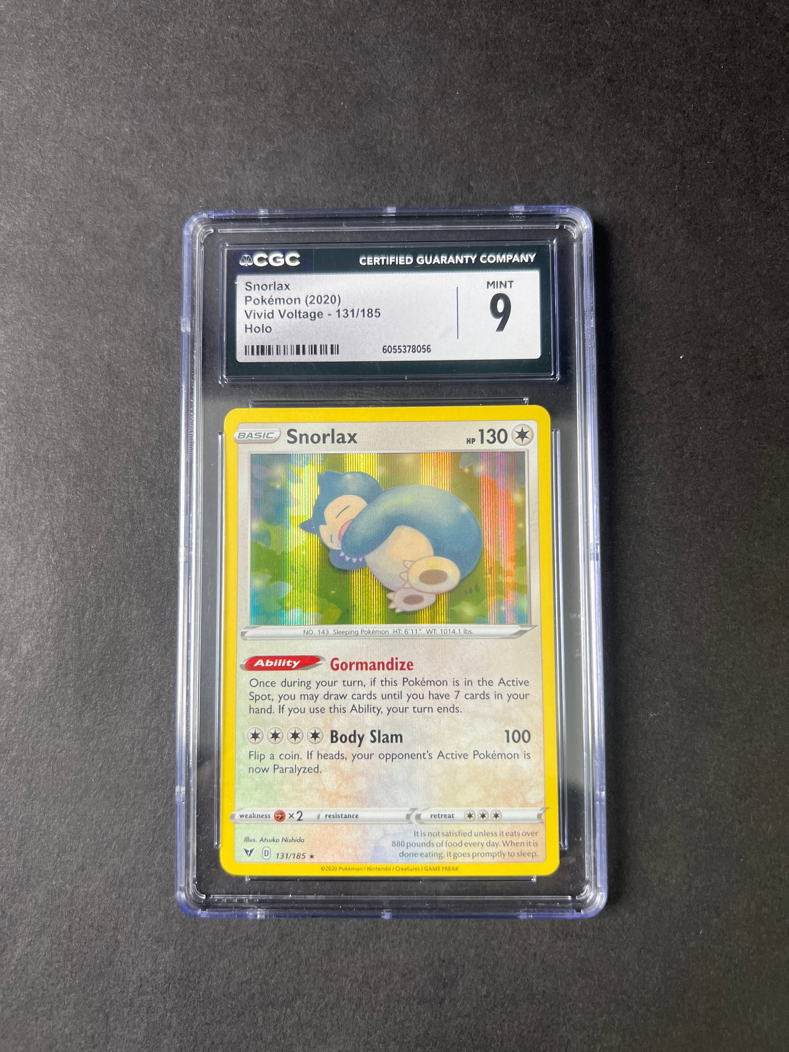 Snorlax Pokemon Card - CGC Graded 9: Graded Snorlax Pokemon card. Encased by CGC and graded 9. Dimensions approximately 10 x 8 cm. Card is from the Sword & Shield series, numbered 131/185.