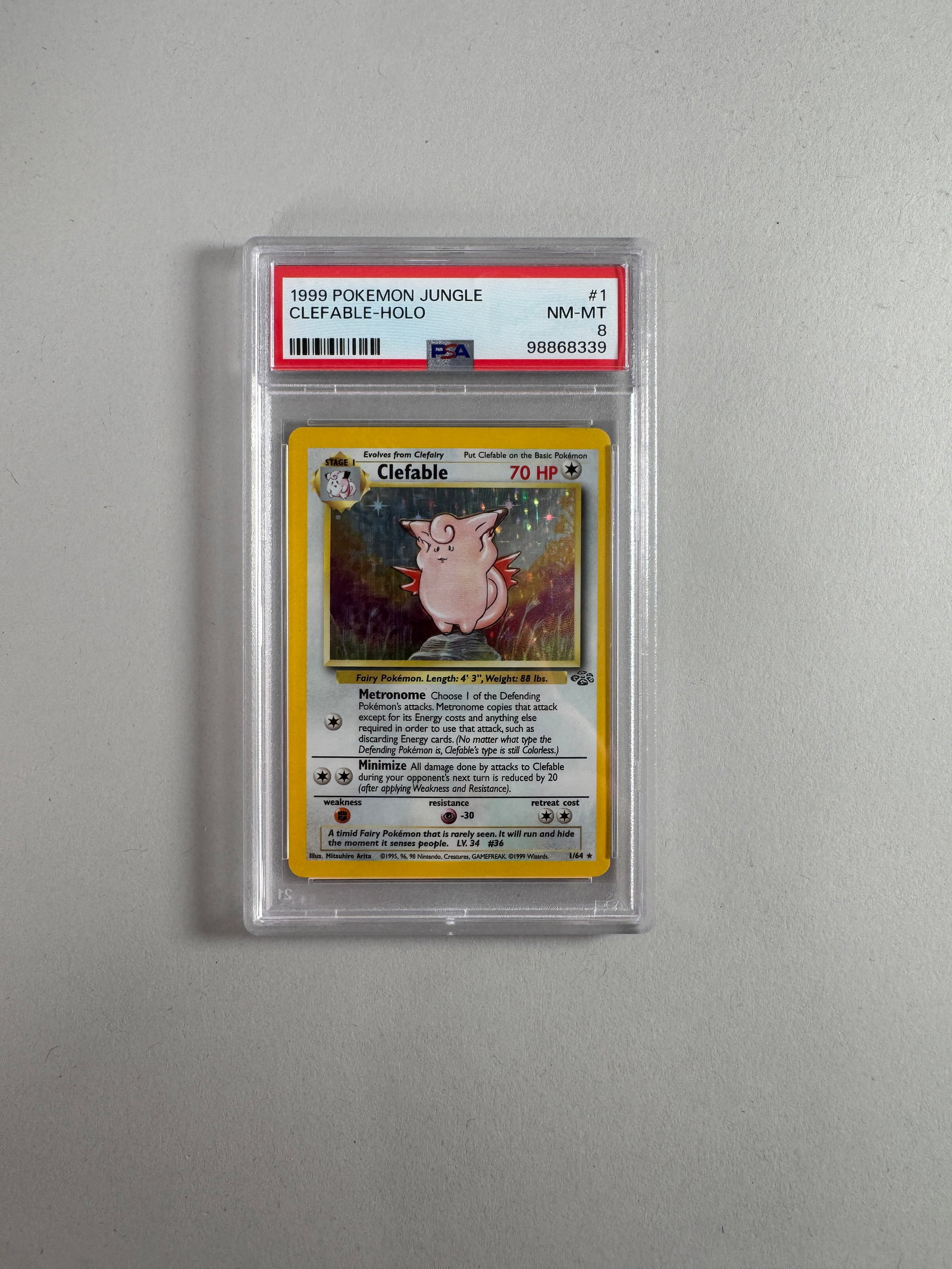 1999 Pokemon Jungle Clefable Holo #1 PSA NM-MT 8: 1999 Pokemon Jungle Clefable Holo card, #1. Professionally graded NM-MT 8 by PSA. Encapsulated for protection and display.