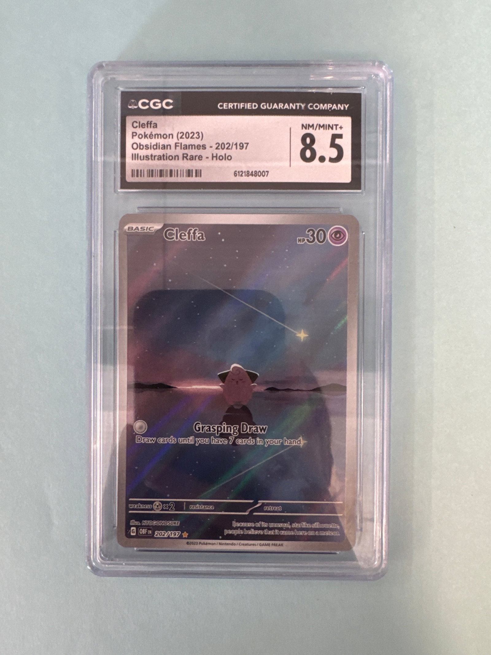 2023 Pokemon Illustration Rare Cleffa 202/197 CGC 8.5: 2023 Pokemon Illustration Rare Cleffa card, numbered 202/197. Graded CGC 8.5 NM/Mint+. Size: 12 x 7.9cm approx. Weight: 2oz. 